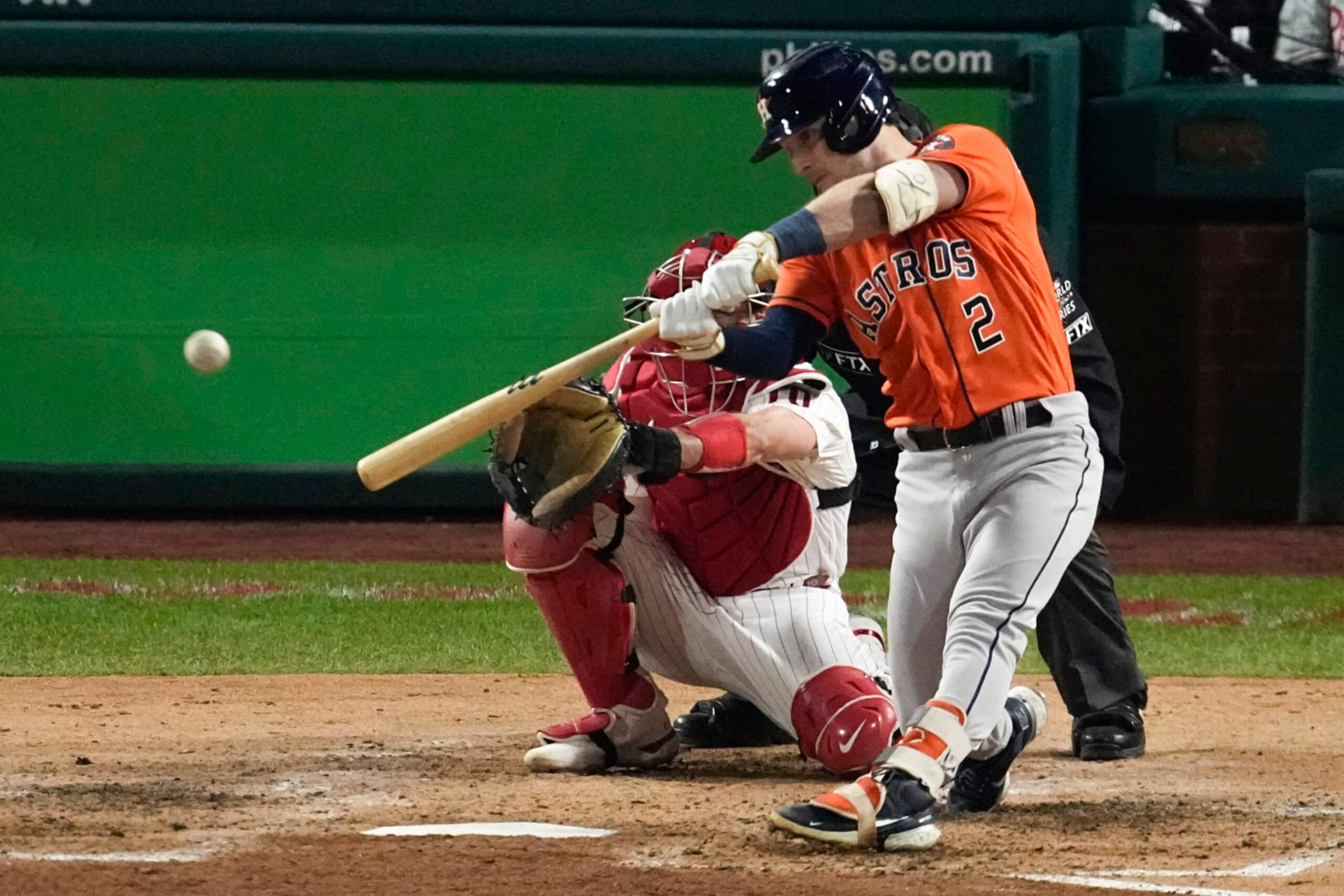 Houston Astros' Alex Bregman hits a two-RBI double during the fifth inning in Game 4 of baseball's World Series between the Houston Astros and the Philadelphia Phillies on Wednesday, Nov. 2, 2022, in Philadelphia. (AP Photo/Matt Rourke)