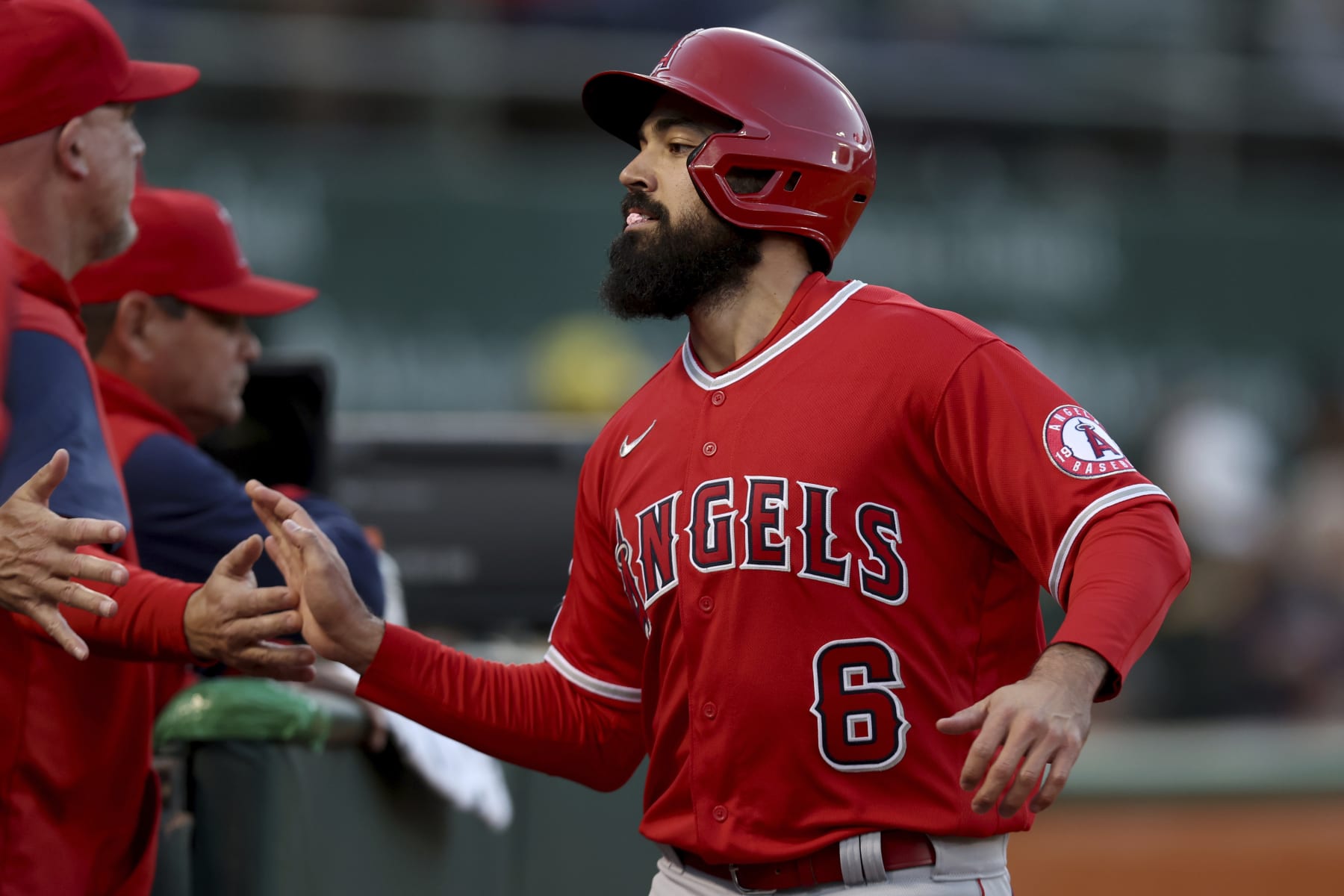 Los Angeles Angels' Anthony Rendon (6) is congratulated after scoring against the Oakland Athletics on a single by Brandon Marsh during the fourth inning of a baseball game in Oakland, Calif., Friday, May 13, 2022. (AP Photo/Jed Jacobsohn)