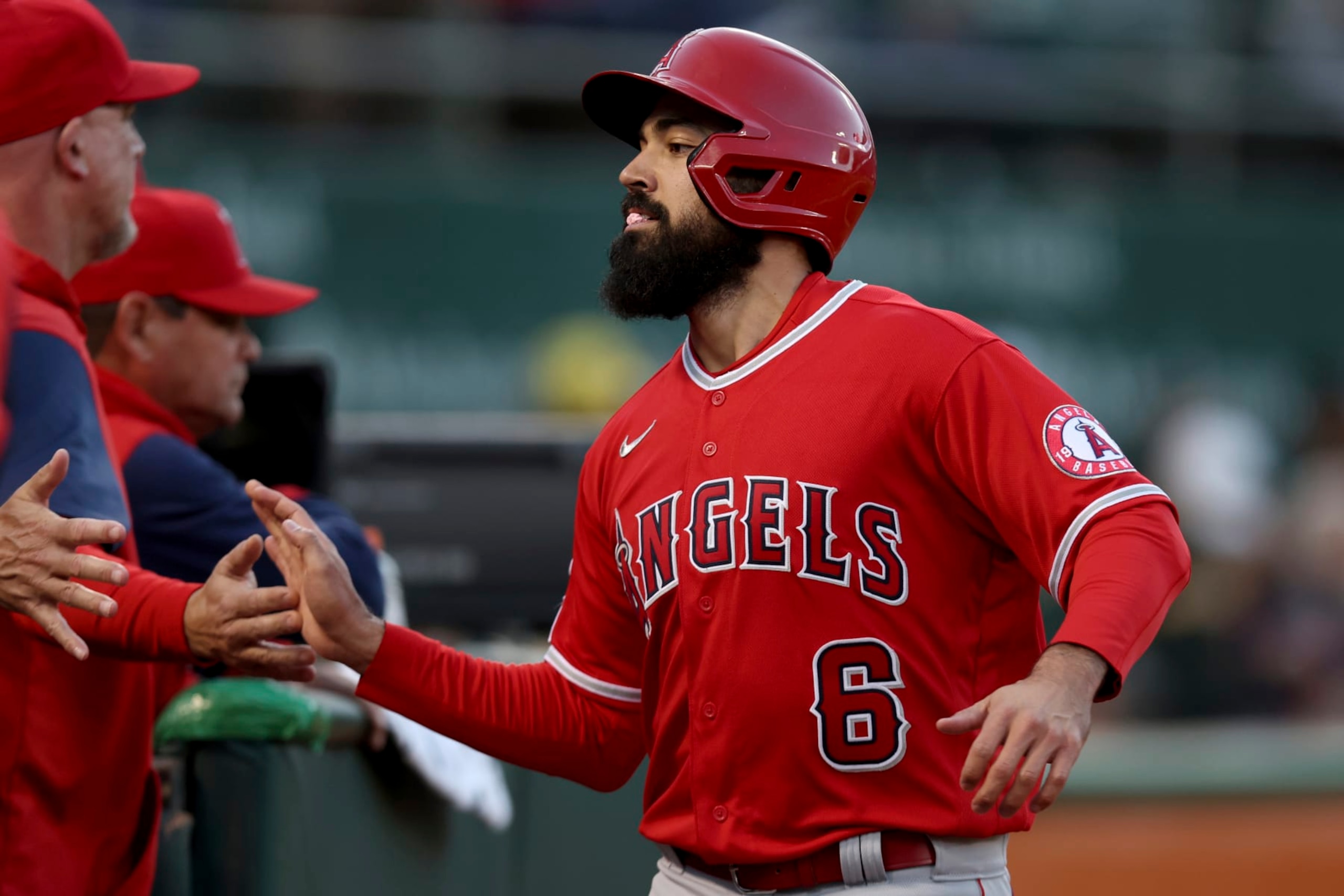Los Angeles Angels' Anthony Rendon (6) is congratulated after scoring against the Oakland Athletics on a single by Brandon Marsh during the fourth inning of a baseball game in Oakland, Calif., Friday, May 13, 2022. (AP Photo/Jed Jacobsohn)