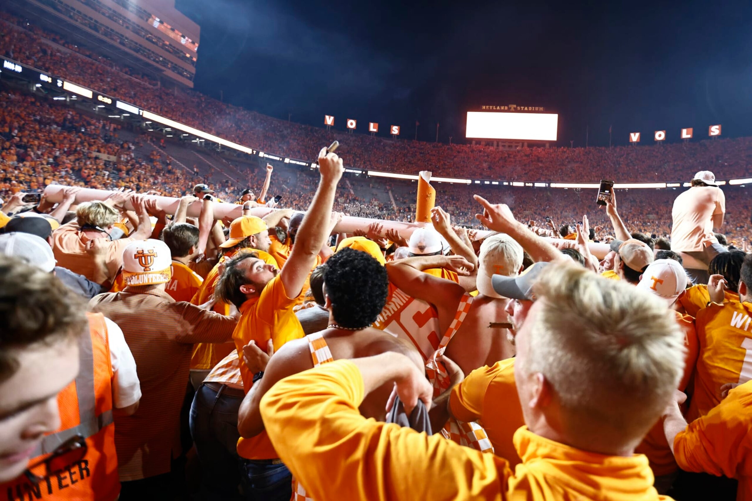 Fans carry a goal post as it was torn down after an NCAA college football game between Tennessee and Alabama Saturday, Oct. 15, 2022, in Knoxville, Tenn. Tennessee won 52-49. (AP Photo/Wade Payne) Fans carry a goal post as it was torn down after an NCAA college football game between Tennessee and Alabama Saturday, Oct. 15, 2022, in Knoxville, Tenn. Tennessee won 52-49. (AP Photo/Wade Payne)