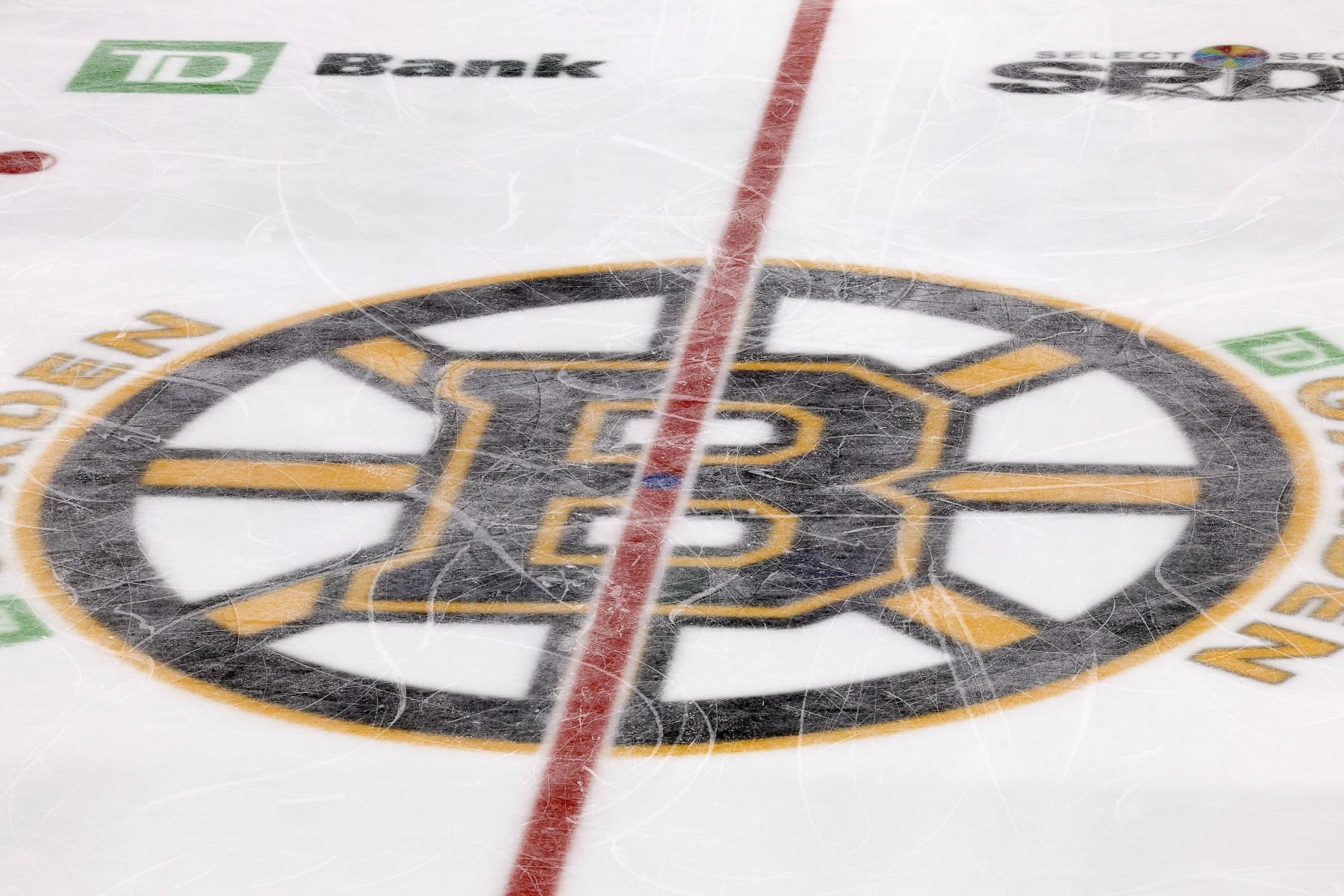 The Boston Bruins logo is seen at center ice at TD Garden during the third period of an NHL hockey game between the Boston Bruins and the Colorado Avalanche Monday, Feb. 21, 2022, in Boston. (AP Photo/Winslow Townson)