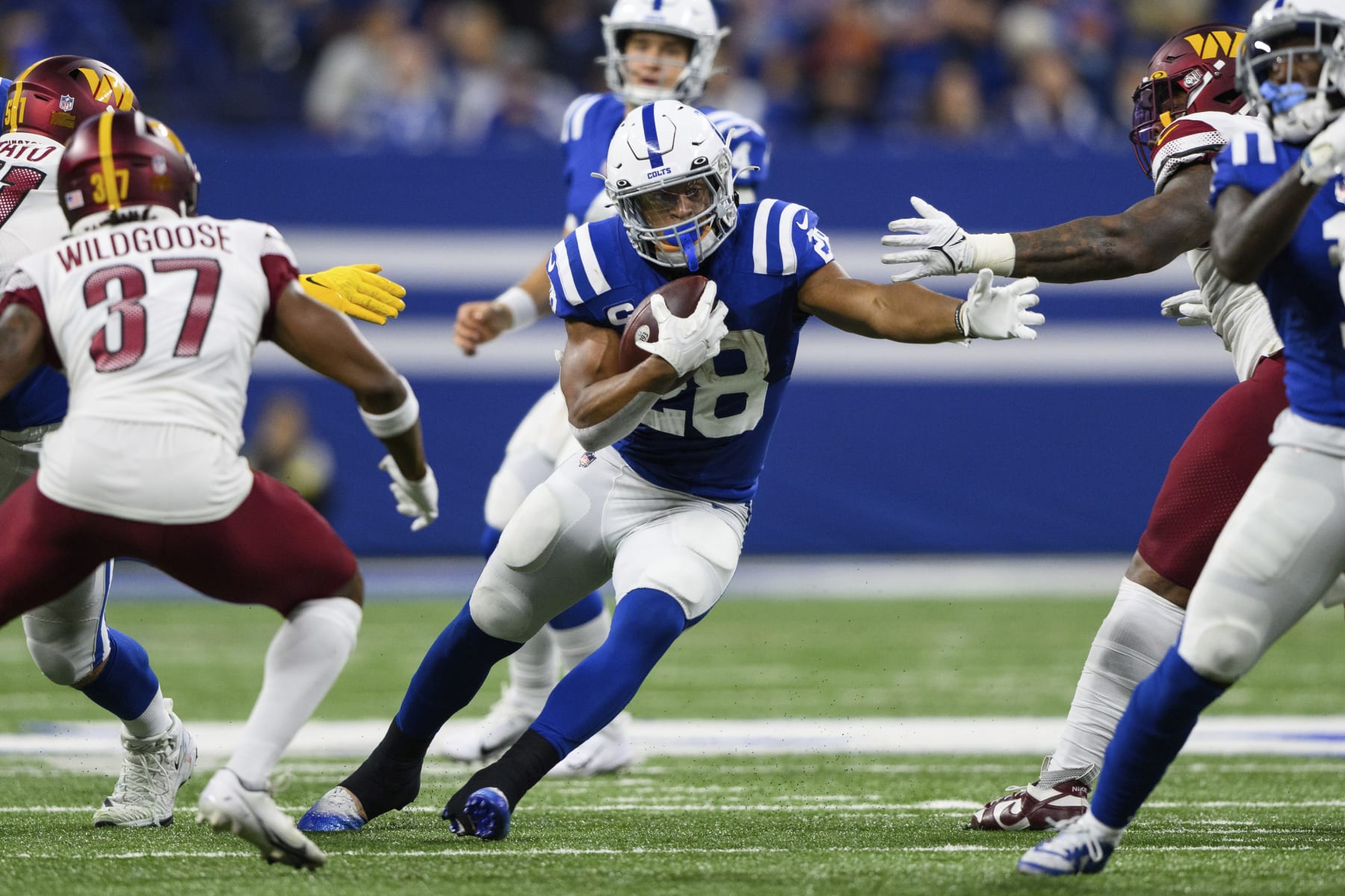 Indianapolis Colts running back Jonathan Taylor (28) runs up the middle during an NFL football game against the Washington Commanders, Sunday, Oct. 30, 2022, in Indianapolis. (AP Photo/Zach Bolinger)