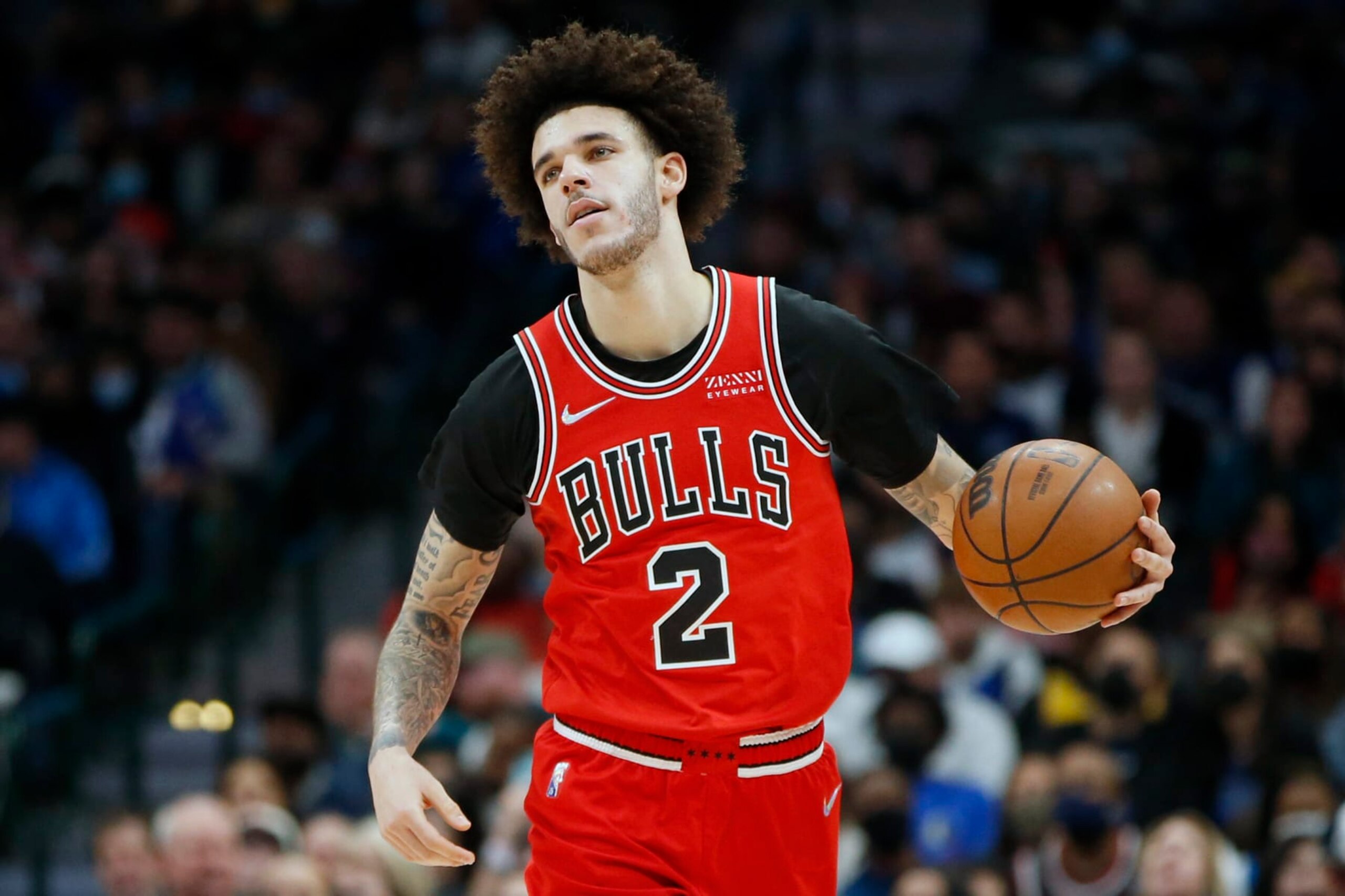 FILE - Chicago Bulls guard Lonzo Ball (2) dribbles up court against the Dallas Mavericks in the first half of an NBA basketball game in Dallas, Sunday, Jan. 9, 2022. Chicago Bulls point guard Lonzo Ball will miss the remainder of the season following another setback in his recovery from surgery for a torn meniscus in his left knee, the team announced on Wednesday, April 6, 2022. (AP Photo/Tim Heitman, File)