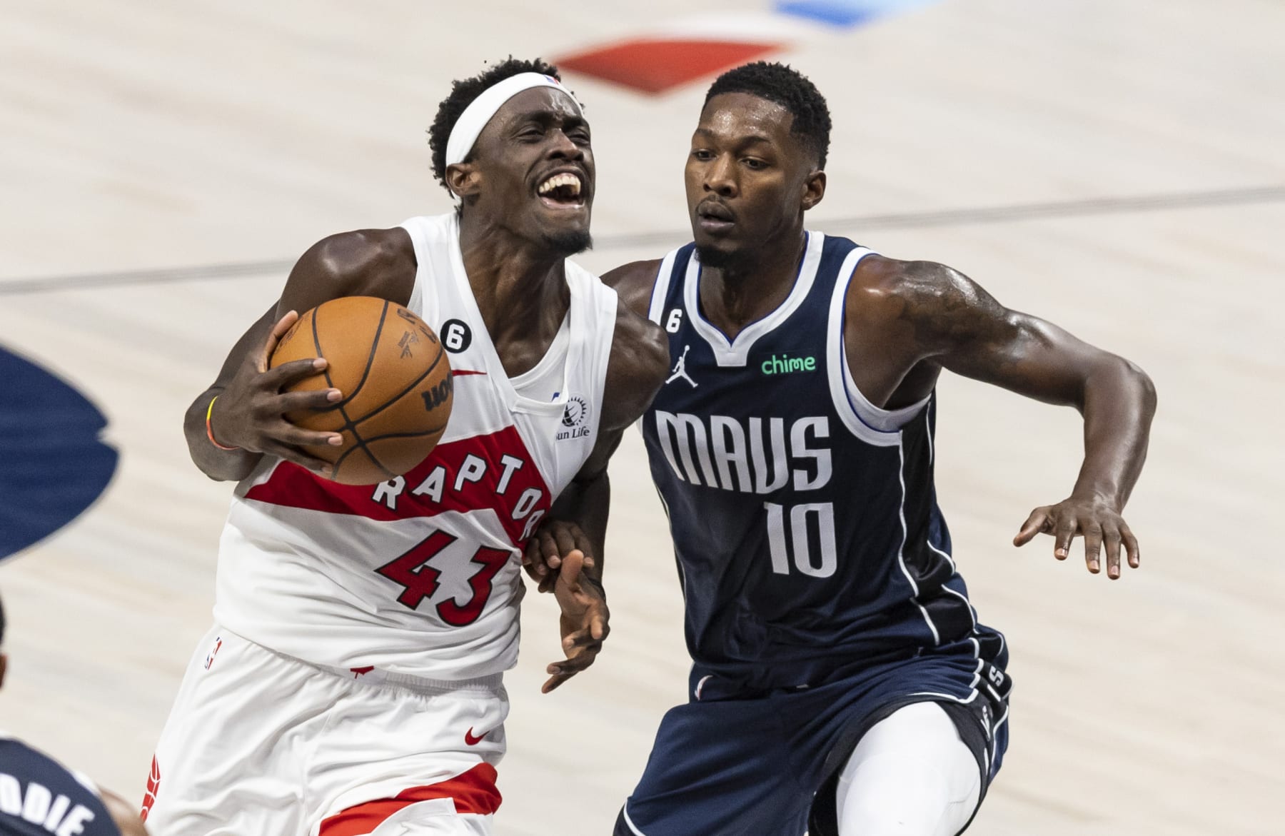 Toronto Raptors forward Pascal Siakam (43) drives against Dallas Mavericks forward Dorian Finney-Smith (10) during the first half of an NBA basketball game, Friday, Nov. 4, 2022, in Dallas. (AP Photo/Brandon Wade)