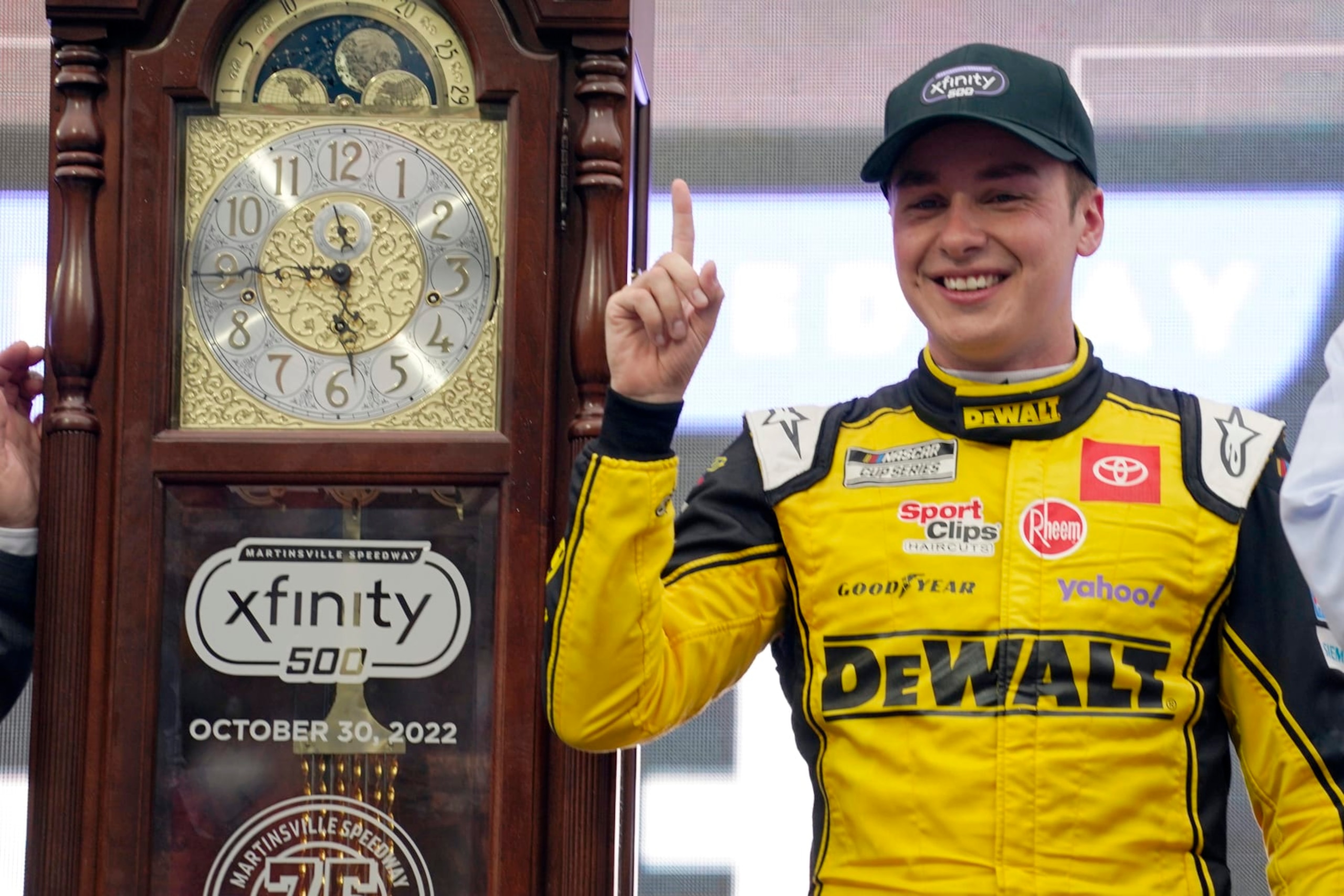 Christopher Bell (20) poses with the trophy in Victory Lane after winning a NASCAR Cup Series auto race at Martinsville Speedway, Sunday, Oct. 30, 2022, in Martinsville, Va. (AP Photo/Chuck Burton) Christopher Bell (20) poses with the trophy in Victory Lane after winning a NASCAR Cup Series auto race at Martinsville Speedway, Sunday, Oct. 30, 2022, in Martinsville, Va. (AP Photo/Chuck Burton)