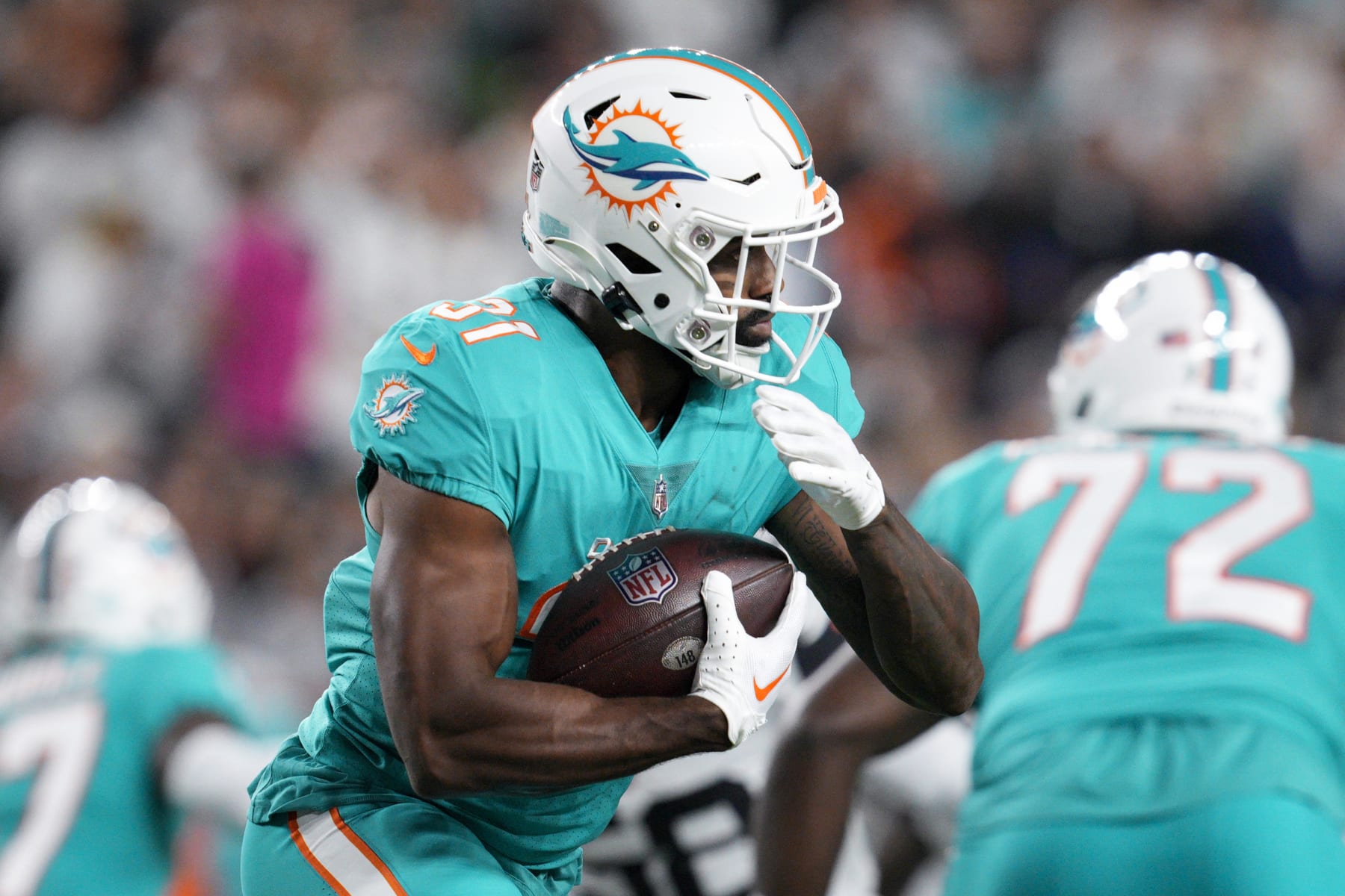 Miami Dolphins running back Raheem Mostert (31) rush during an NFL football game against the Cincinnati Bengals, Friday, Sept. 30, 2022, in Cincinnati. (AP Photo/Jeff Dean)