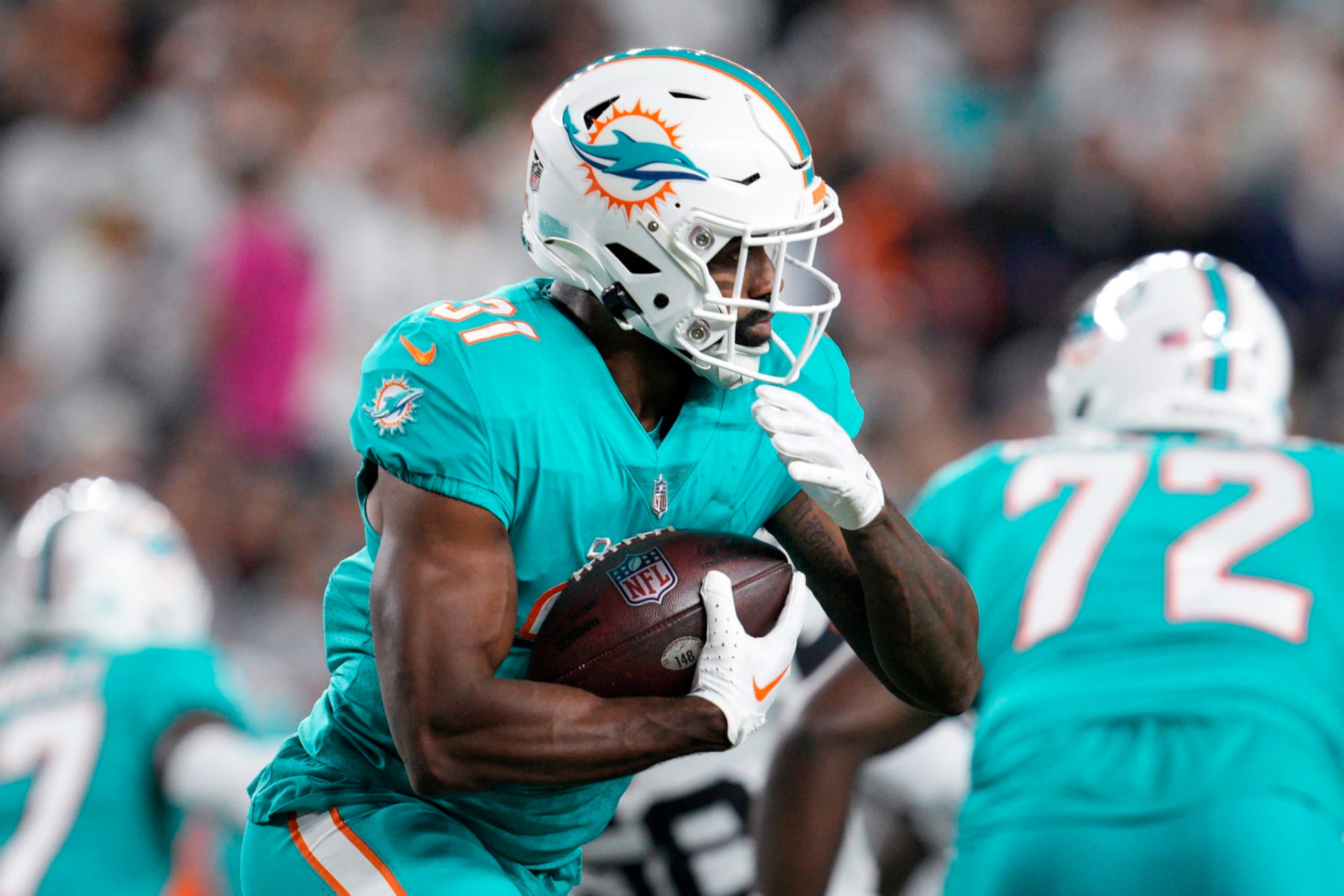 Miami Dolphins running back Raheem Mostert (31) rush during an NFL football game against the Cincinnati Bengals, Friday, Sept. 30, 2022, in Cincinnati. (AP Photo/Jeff Dean) Miami Dolphins running back Raheem Mostert (31) rush during an NFL football game against the Cincinnati Bengals, Friday, Sept. 30, 2022, in Cincinnati. (AP Photo/Jeff Dean)