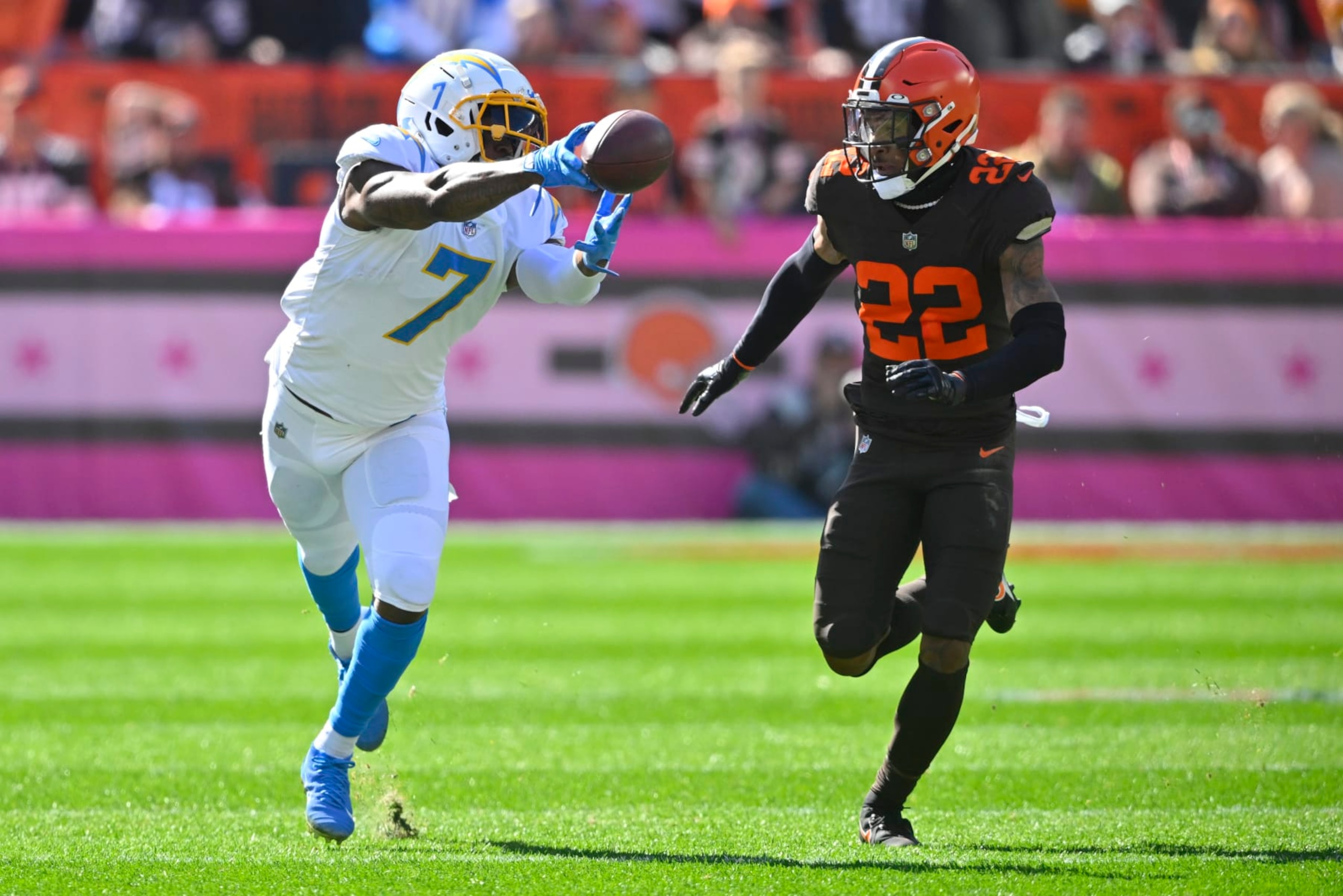 Los Angeles Chargers tight end Gerald Everett (7) can't quite make the catch as Cleveland Browns safety Grant Delpit (22) defends during the first half of an NFL football game, Sunday, Oct. 9, 2022, in Cleveland. (AP Photo/David Richard) Los Angeles Chargers tight end Gerald Everett (7) can't quite make the catch as Cleveland Browns safety Grant Delpit (22) defends during the first half of an NFL football game, Sunday, Oct. 9, 2022, in Cleveland. (AP Photo/David Richard)