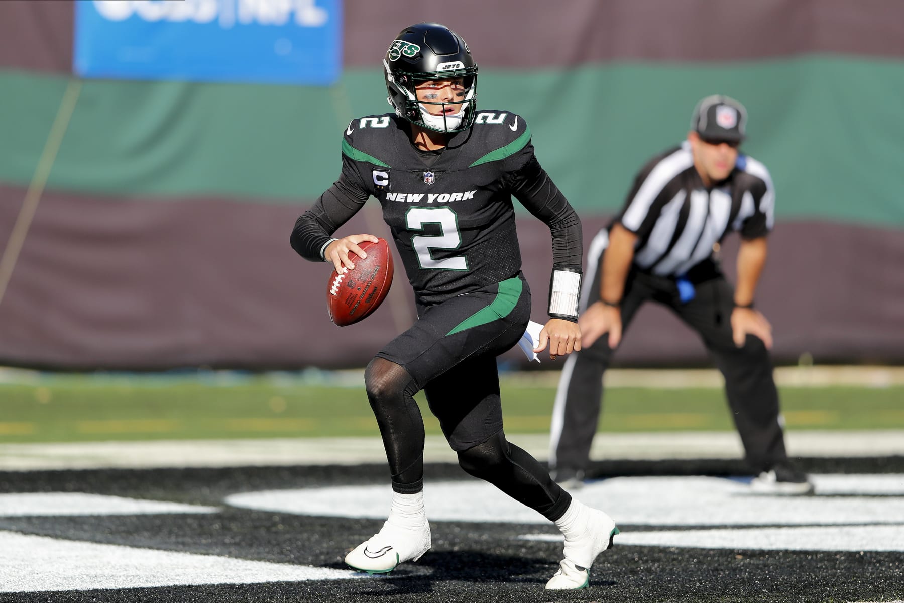New York Jets quarterback Zach Wilson (2) looks to pass against the New England Patriots during the third quarter of an NFL football game, Sunday, Oct. 30, 2022, in New York. (AP Photo/Noah Murray)