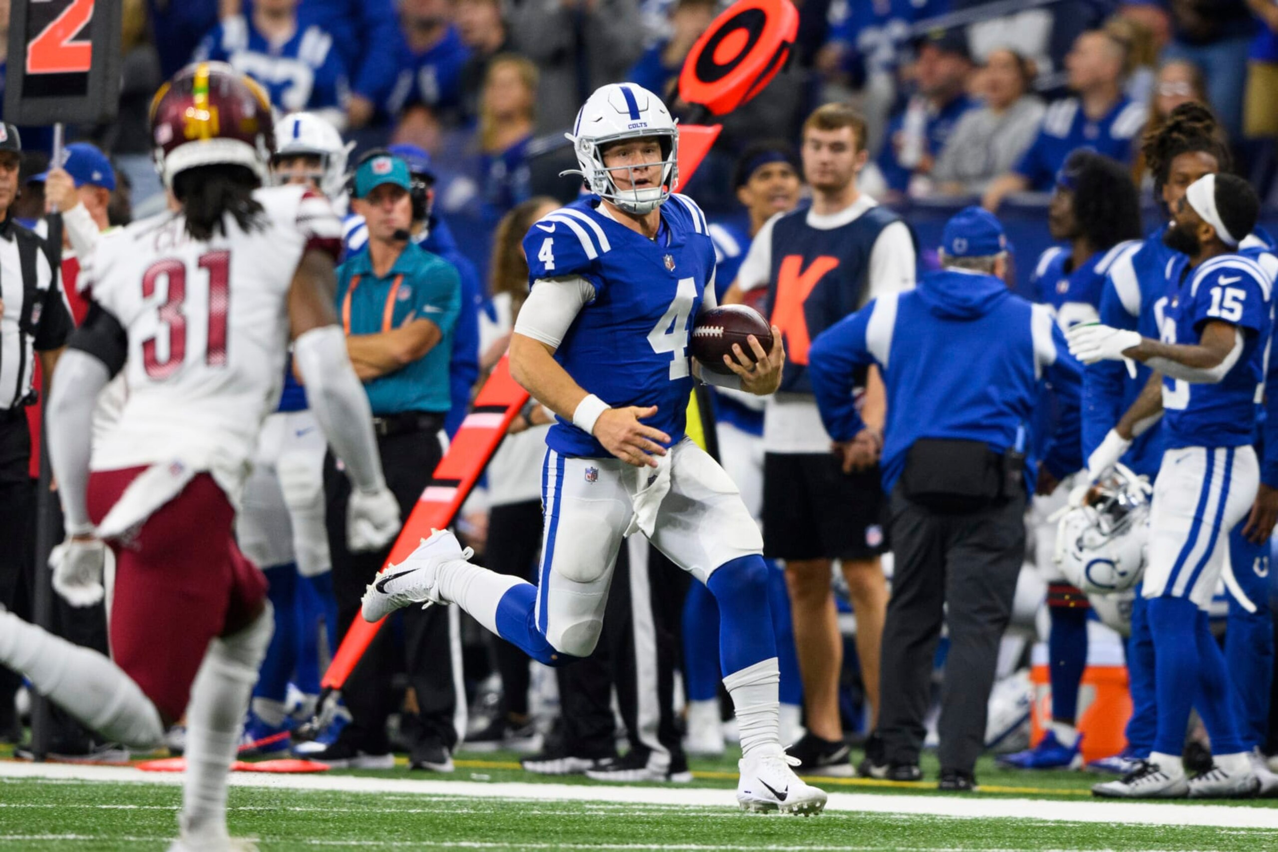 Indianapolis Colts quarterback Sam Ehlinger (4) runs down the sidelines during an NFL football game against the Washington Commanders, Sunday, Oct. 30, 2022, in Indianapolis. (AP Photo/Zach Bolinger) Indianapolis Colts quarterback Sam Ehlinger (4) runs down the sidelines during an NFL football game against the Washington Commanders, Sunday, Oct. 30, 2022, in Indianapolis. (AP Photo/Zach Bolinger)