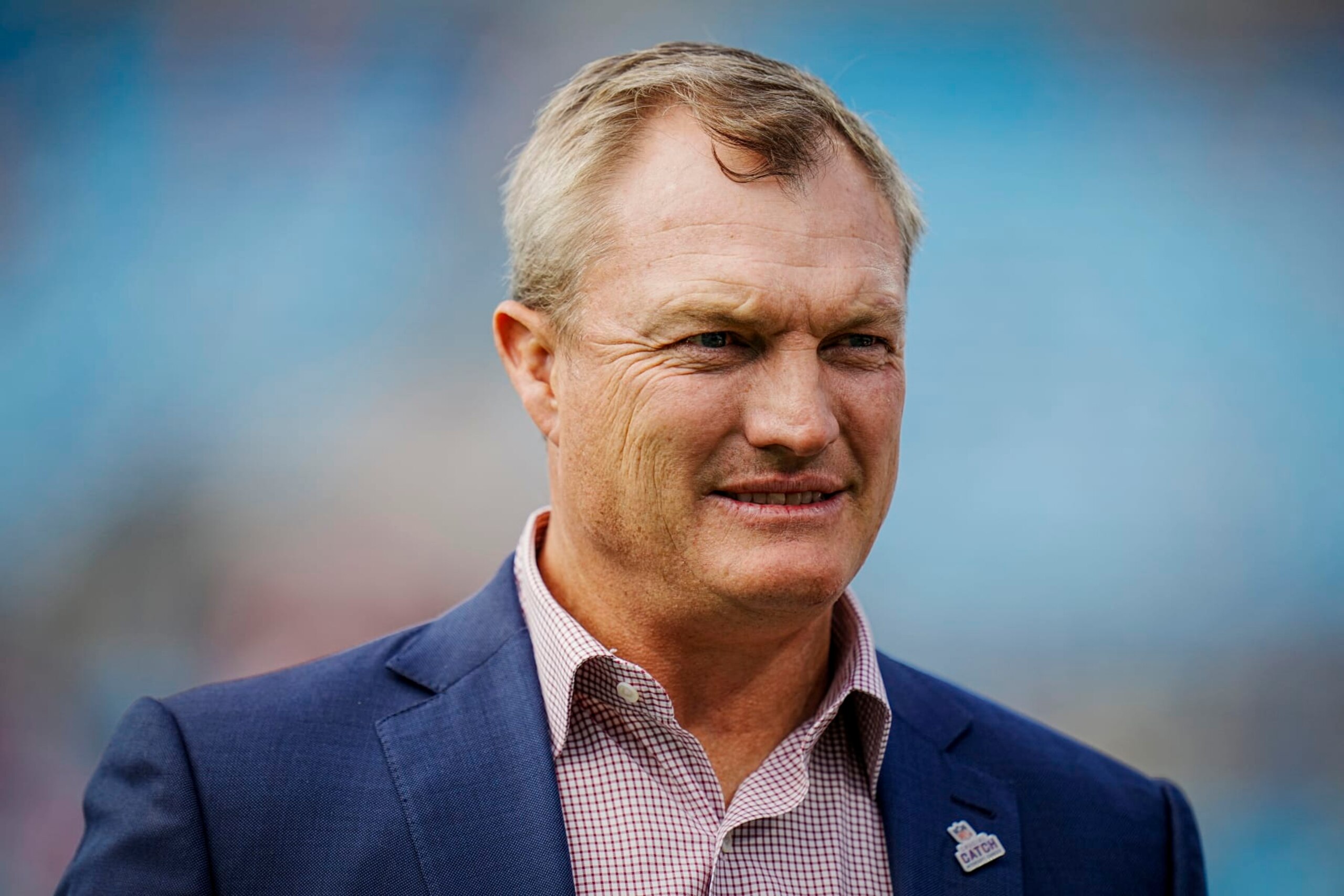 San Francisco 49ers general manager John Lynch walks the sidelines during an NFL football game against the Carolina Panthers on Sunday, Oct. 09, 2022, in Charlotte, N.C. (AP Photo/Rusty Jones)