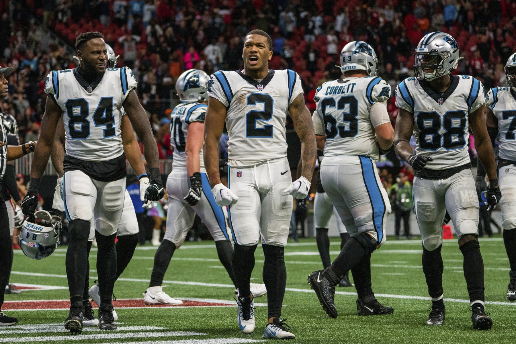 Carolina Panthers wide receiver DJ Moore (2) celebrates a touchdown with tight end Stephen Sullivan (84) and wide receiver Terrace Marshall Jr. (88) during the second half of an NFL football game against the Atlanta Falcons, Sunday, Oct. 30, 2022, in Atlanta. The Atlanta Falcons won 37-34. (AP Photo/Danny Karnik)