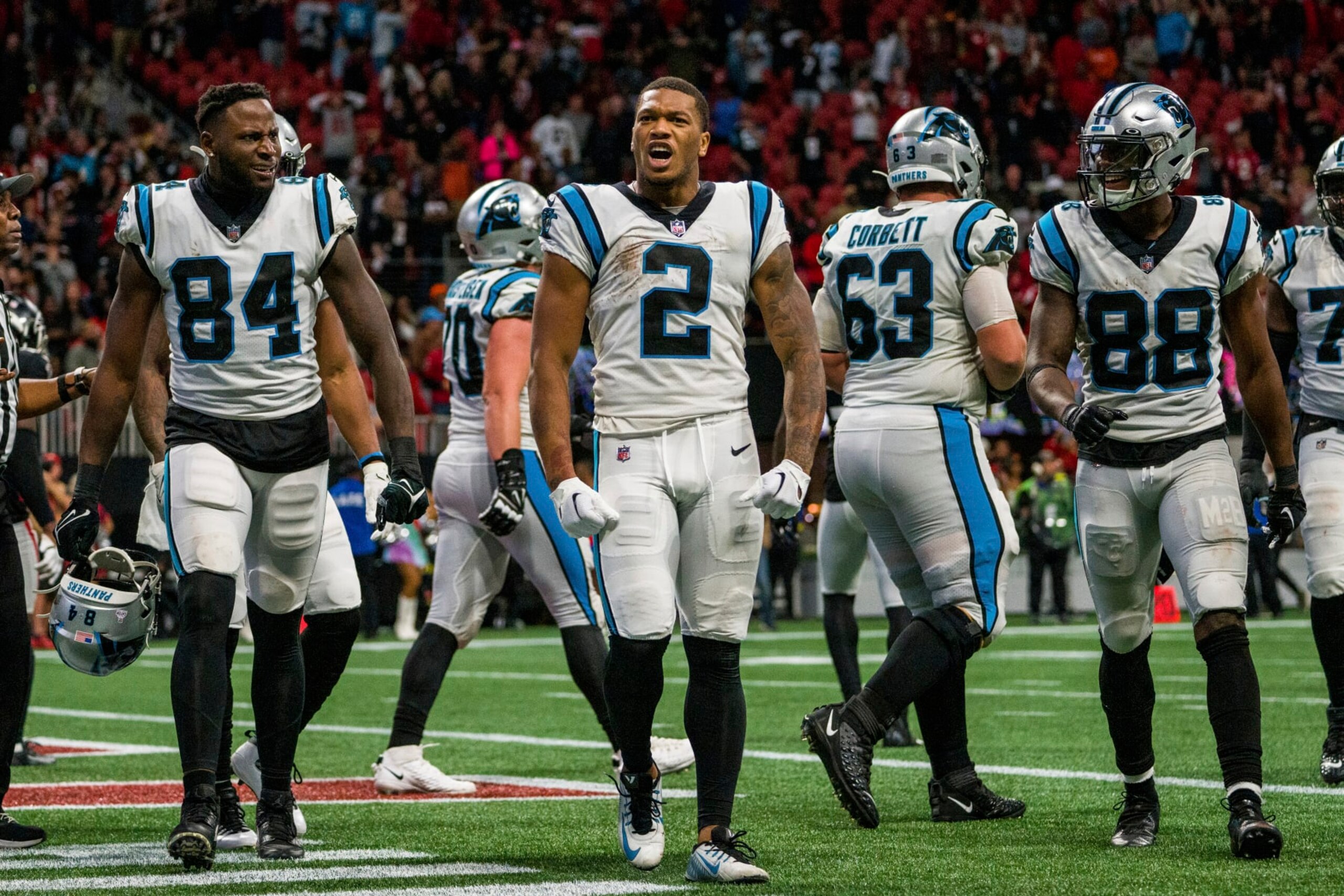 Carolina Panthers wide receiver DJ Moore (2) celebrates a touchdown with tight end Stephen Sullivan (84) and wide receiver Terrace Marshall Jr. (88) during the second half of an NFL football game against the Atlanta Falcons, Sunday, Oct. 30, 2022, in Atlanta. The Atlanta Falcons won 37-34. (AP Photo/Danny Karnik)