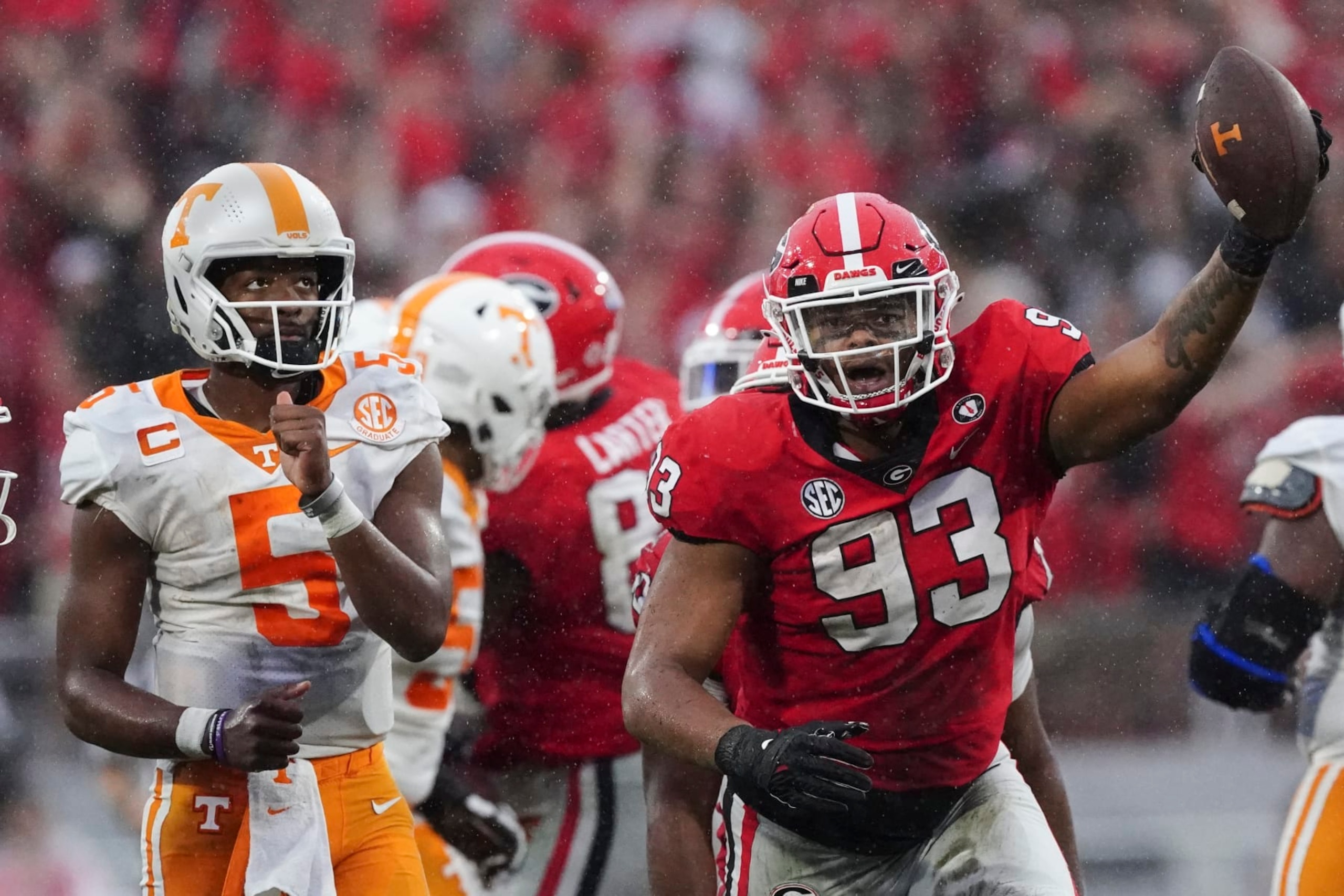 Georgia defensive lineman Tyrion Ingram-Dawkins (93) reacts after recovering a fumble during the second half of an NCAA college football game as Tennessee quarterback Hendon Hooker (5) looks on Saturday, Nov. 5, 2022 in Athens, Ga. (AP Photo/John Bazemore) Georgia defensive lineman Tyrion Ingram-Dawkins (93) reacts after recovering a fumble during the second half of an NCAA college football game as Tennessee quarterback Hendon Hooker (5) looks on Saturday, Nov. 5, 2022 in Athens, Ga. (AP Photo/John Bazemore)