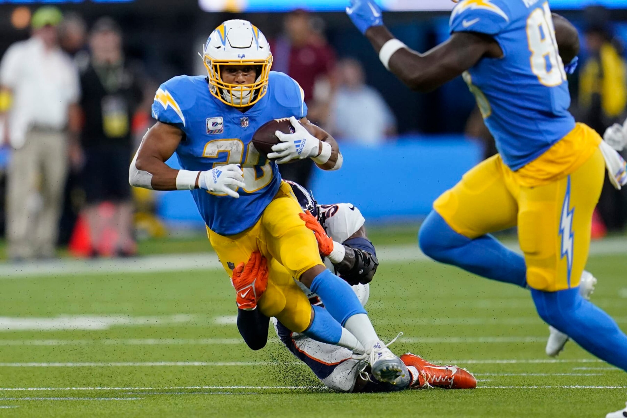 Los Angeles Chargers running back Austin Ekeler, front, is hit by Denver Broncos linebacker Jonas Griffith during the first half of an NFL football game, Monday, Oct. 17, 2022, in Inglewood, Calif. (AP Photo/Marcio Jose Sanchez) Los Angeles Chargers running back Austin Ekeler, front, is hit by Denver Broncos linebacker Jonas Griffith during the first half of an NFL football game, Monday, Oct. 17, 2022, in Inglewood, Calif. (AP Photo/Marcio Jose Sanchez)