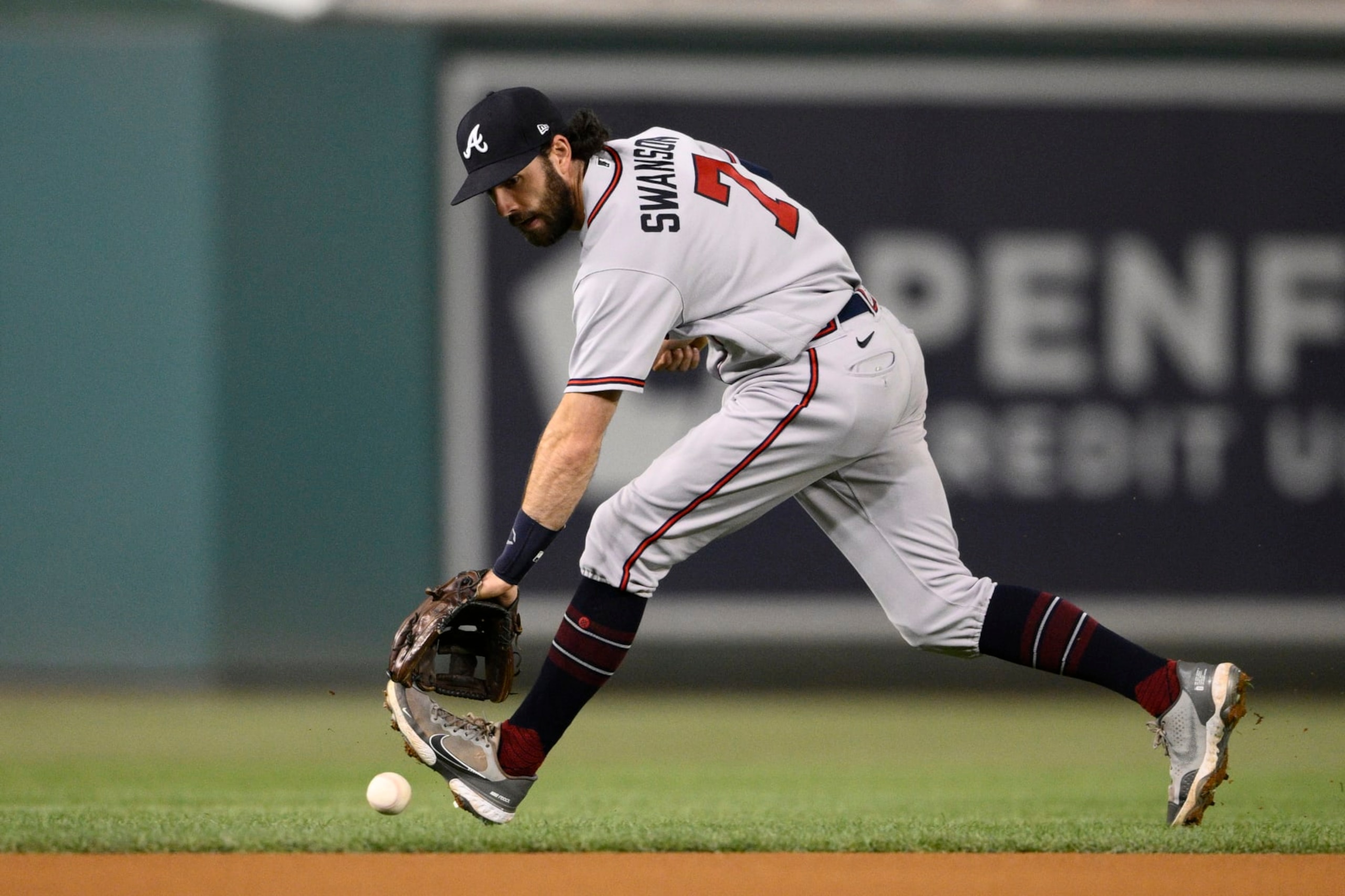 Atlanta Braves shortstop Dansby Swanson chases a ball that went for a single by Washington Nationals' CJ Abrams during the first inning of a baseball game Wednesday, Sept. 28, 2022, in Washington. (AP Photo/Nick Wass) Atlanta Braves shortstop Dansby Swanson chases a ball that went for a single by Washington Nationals' CJ Abrams during the first inning of a baseball game Wednesday, Sept. 28, 2022, in Washington. (AP Photo/Nick Wass)