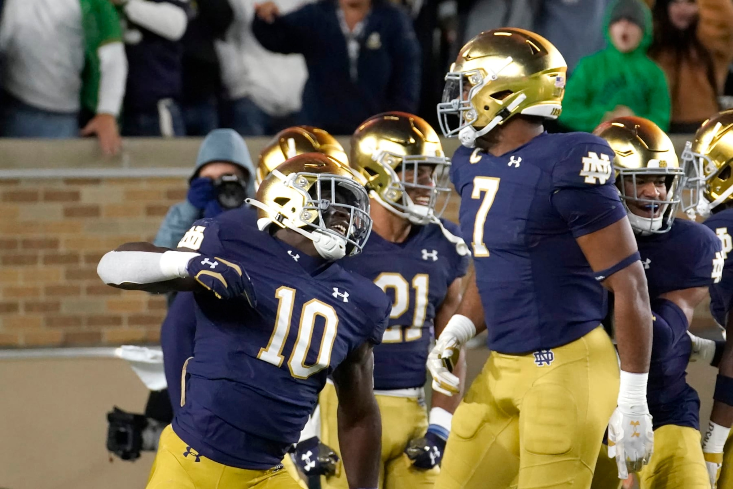 Notre Dame's Prince Kollie celebrates after scoring on the blocked of Clemson's Aidan Swanson's punt during the first half of an NCAA college football game Saturday, Nov. 5, 2022, in South Bend, Ind. (AP Photo/Charles Rex Arbogast)