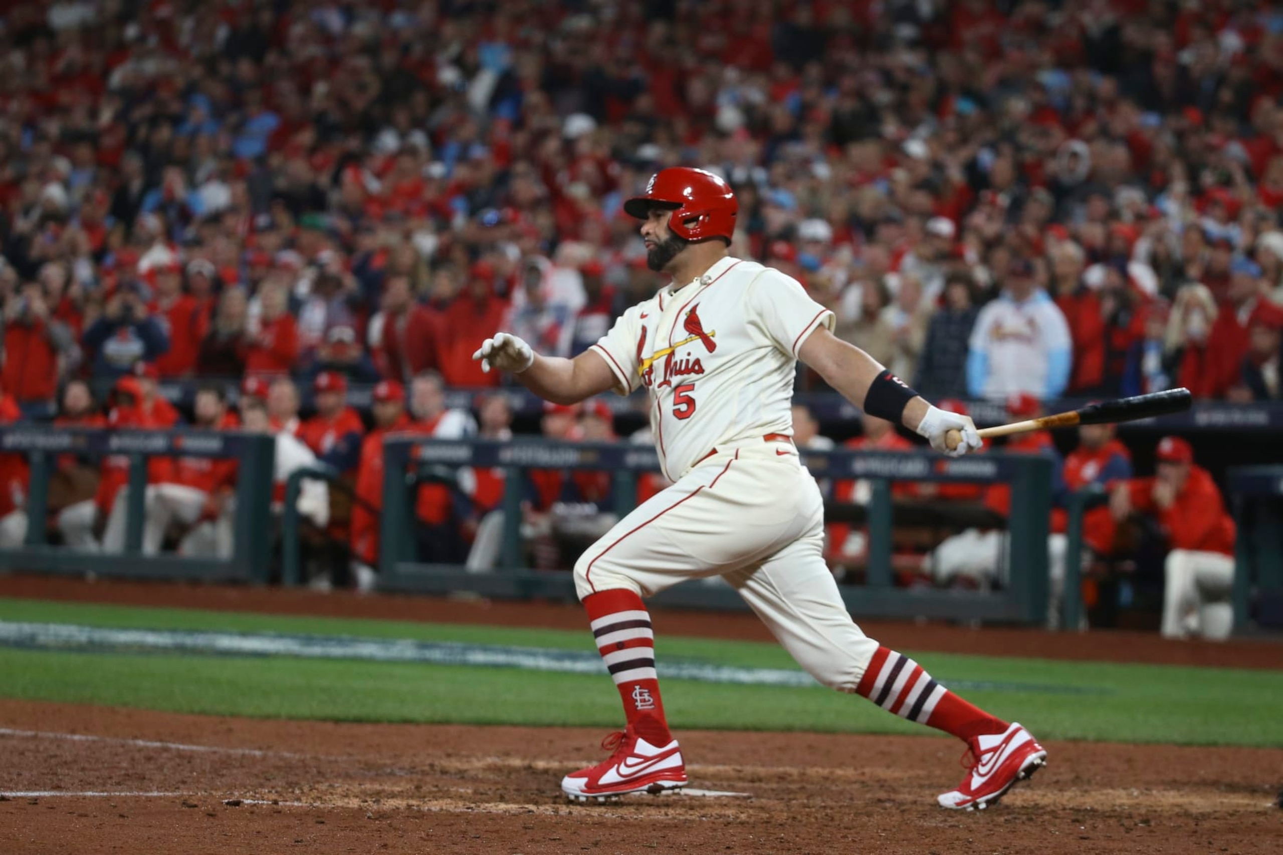 St. Louis Cardinals' Albert Pujols hits a single during the eighth inning in Game 2 of a National League wild-card baseball playoff series against the Philadelphia Phillies, Saturday, Oct. 8, 2022, in St. Louis. (AP Photo/Scott Kane)