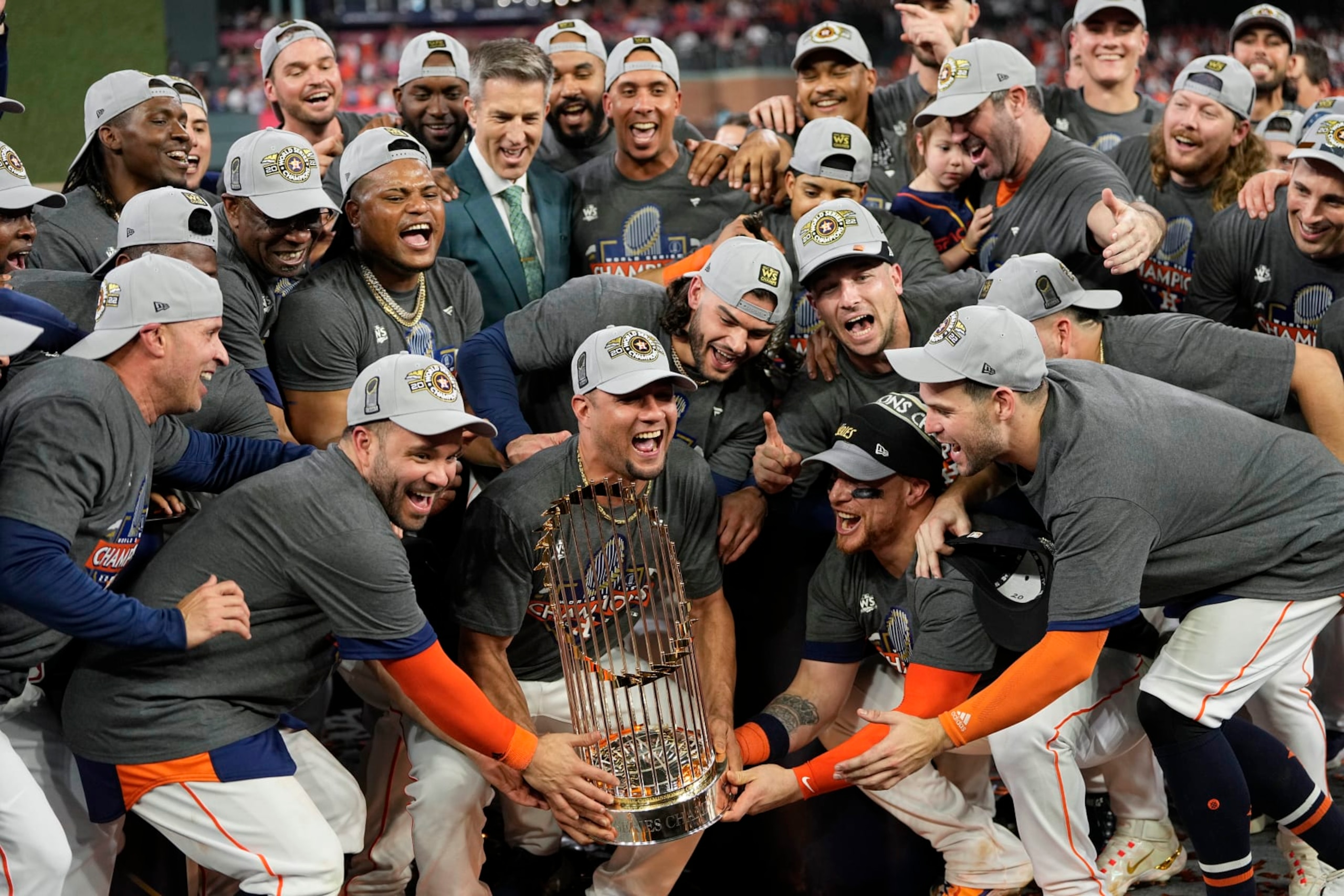 The Houston Astros celebrate with the trophy after their 4-1 World Series win against the Philadelphia Phillies in Game 6 on Saturday, Nov. 5, 2022, in Houston. (AP Photo/David J. Phillip)