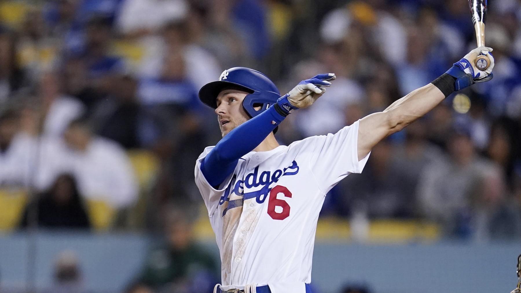 Los Angeles Dodgers' Trea Turner bats during the sixth inning in Game 1 of a baseball NL Division Series against the San Diego Padres Tuesday, Oct. 11, 2022, in Los Angeles. (AP Photo/Marcio Jose Sanchez)