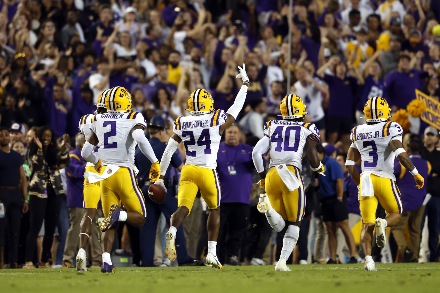 LSU cornerback Jarrick Bernard-Converse (24) celebrates after making an interception during the first half of an NCAA college football game against Alabama in Baton Rouge, La., Saturday, Nov. 5, 2022. (AP Photo/Tyler Kaufman)