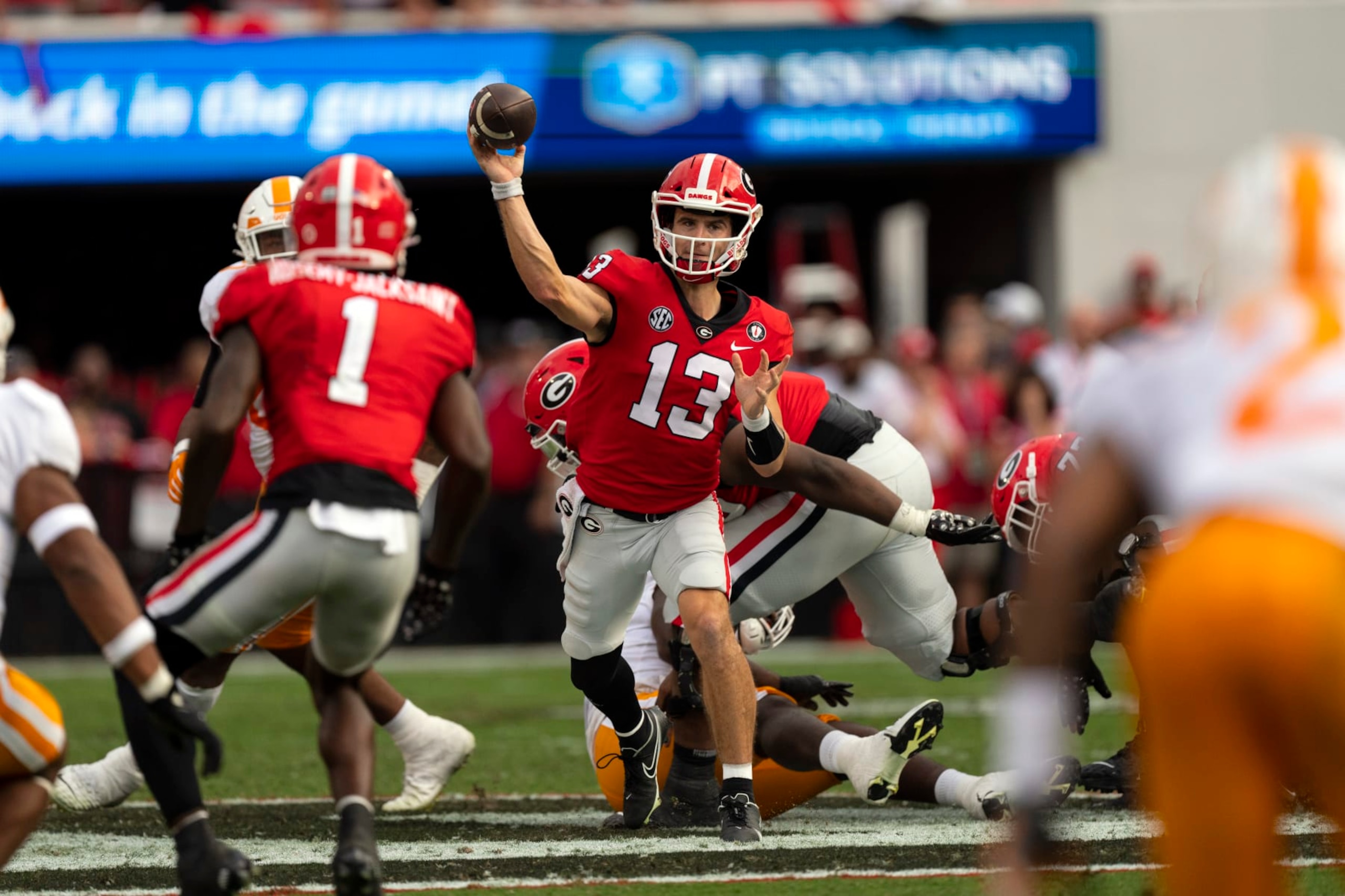 Georgia quarterback Stetson Bennett (13) throws from the pocket during the first half of an NCAA college football game against Tennessee, Saturday, Nov. 5, 2022 in Athens, Ga. (AP Photo/John Bazemore) Georgia quarterback Stetson Bennett (13) throws from the pocket during the first half of an NCAA college football game against Tennessee, Saturday, Nov. 5, 2022 in Athens, Ga. (AP Photo/John Bazemore)