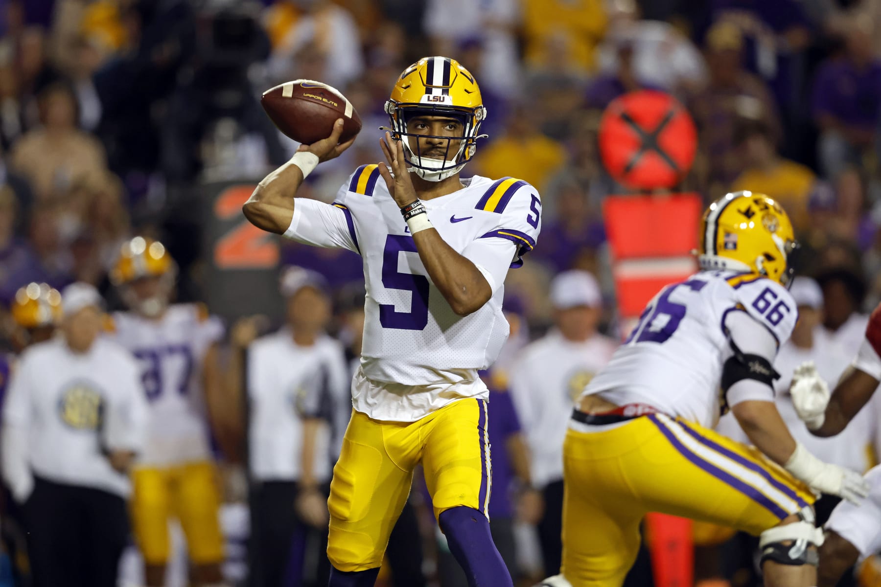 LSU quarterback Jayden Daniels (5) throws a pass during the first half of the team's NCAA college football game against Alabama in Baton Rouge, La., Saturday, Nov. 5, 2022. LSU won 32-31. (AP Photo/Tyler Kaufman)