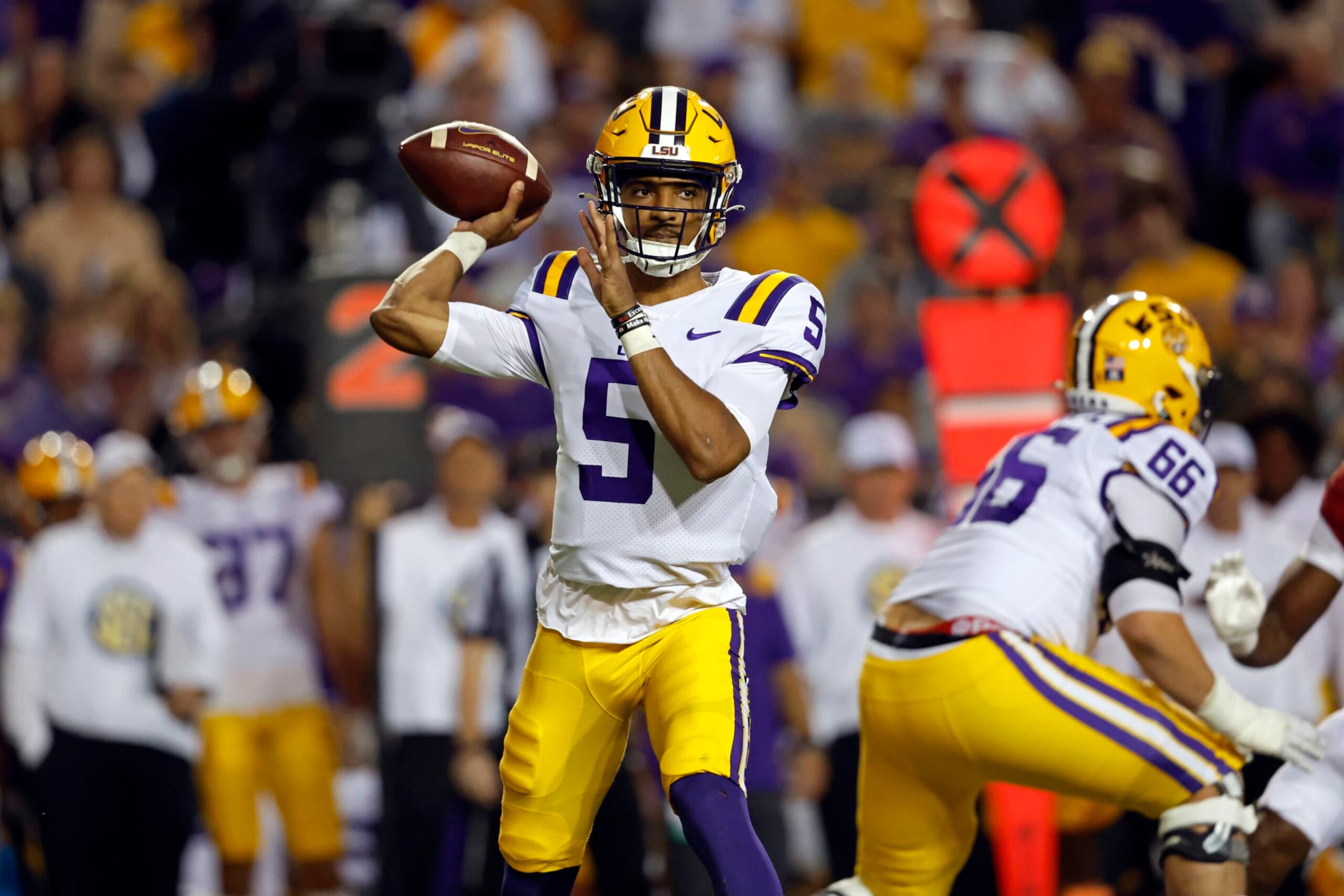 LSU quarterback Jayden Daniels (5) throws a pass during the first half of the team's NCAA college football game against Alabama in Baton Rouge, La., Saturday, Nov. 5, 2022. LSU won 32-31. (AP Photo/Tyler Kaufman) LSU quarterback Jayden Daniels (5) throws a pass during the first half of the team's NCAA college football game against Alabama in Baton Rouge, La., Saturday, Nov. 5, 2022. LSU won 32-31. (AP Photo/Tyler Kaufman)