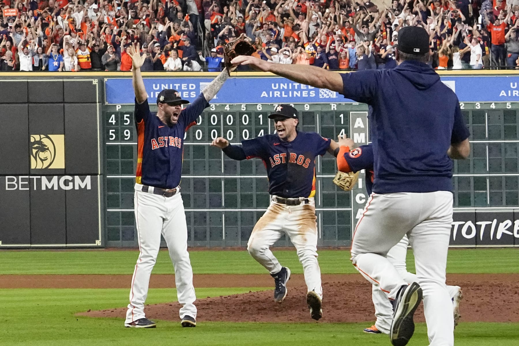 Houston Astros relief pitcher Ryan Pressly, left, and the Houston Astros celebrate their 4-1 World Series win against the Philadelphia Phillies in Game 6 on Saturday, Nov. 5, 2022, in Houston. (AP Photo/David J. Phillip)