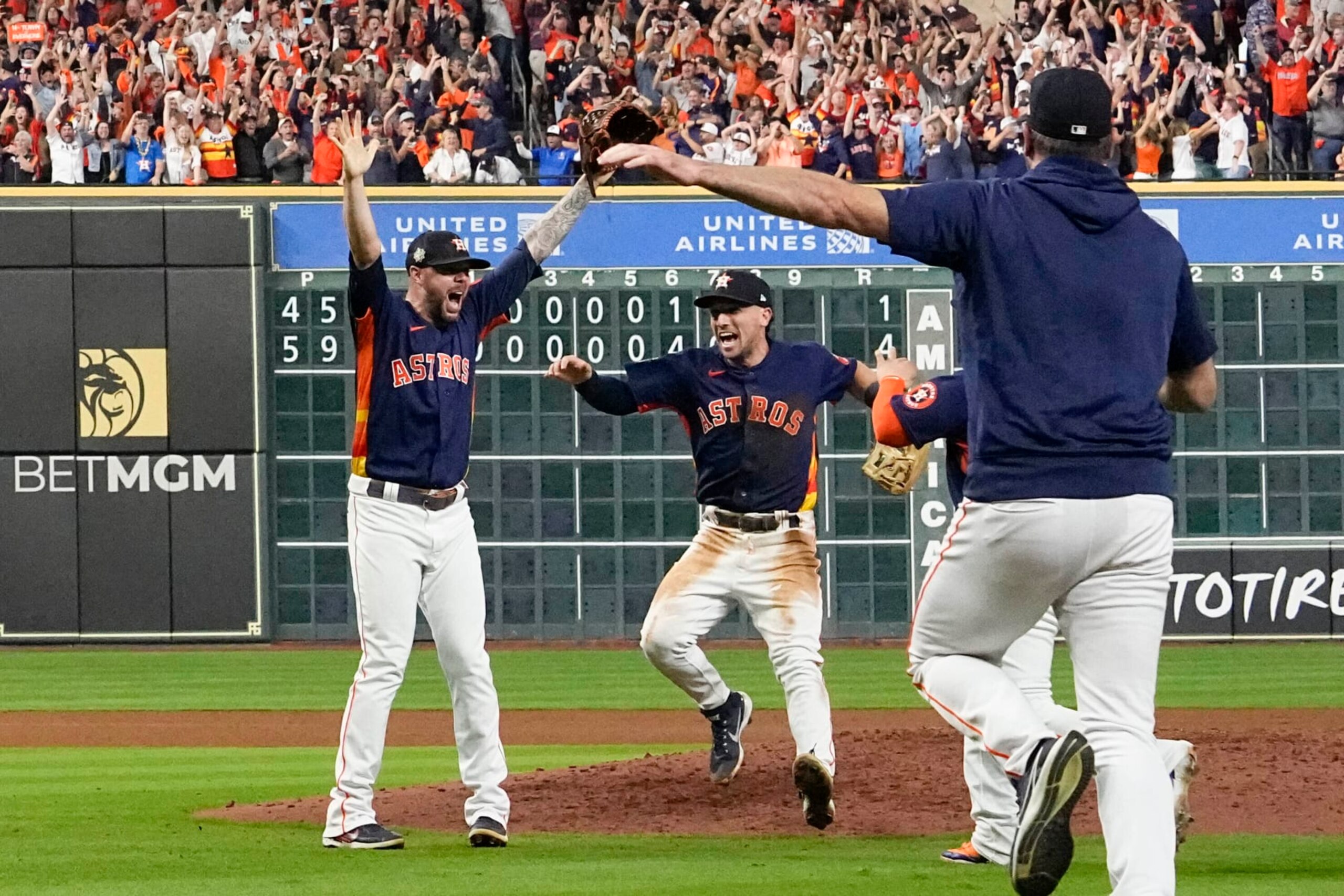Houston Astros relief pitcher Ryan Pressly, left, and the Houston Astros celebrate their 4-1 World Series win against the Philadelphia Phillies in Game 6 on Saturday, Nov. 5, 2022, in Houston. (AP Photo/David J. Phillip)