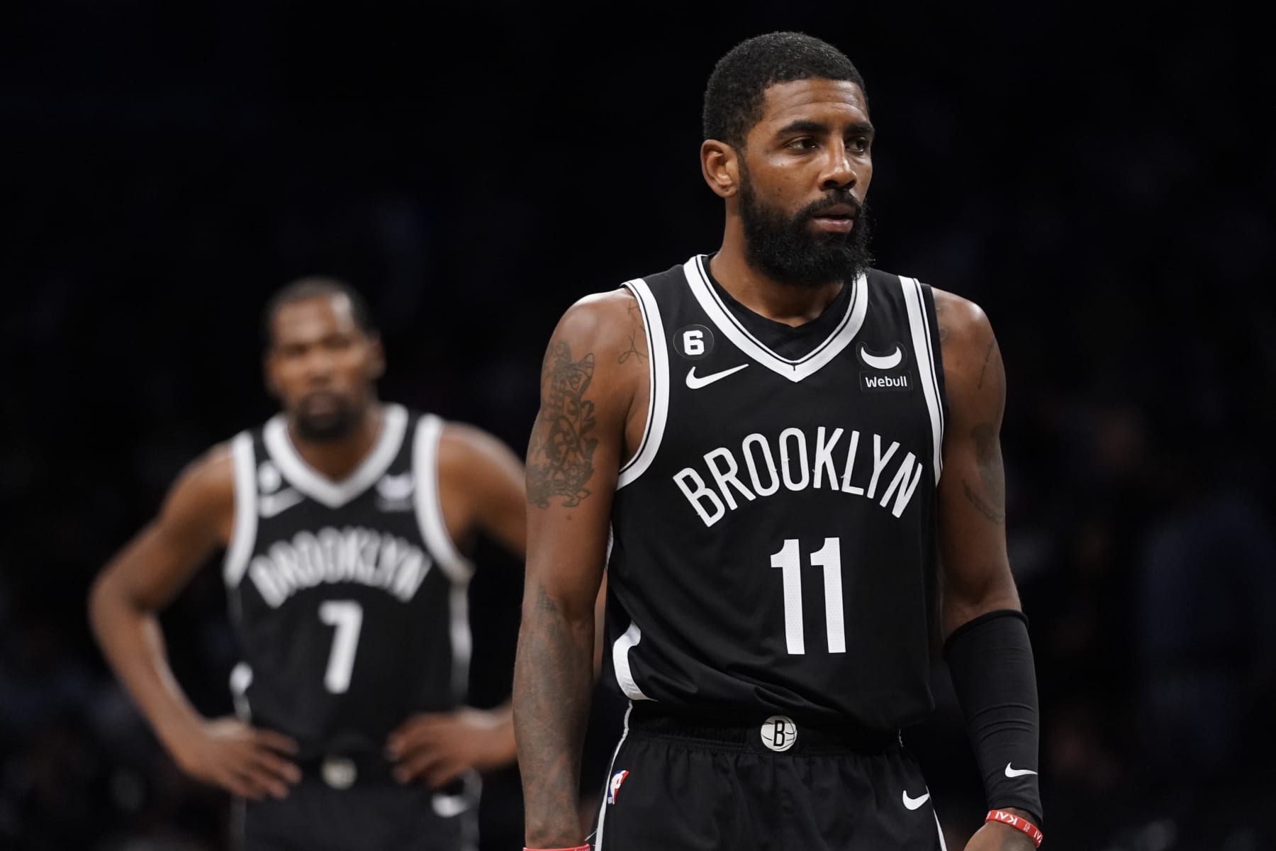 Brooklyn Nets guard Kyrie Irving (11) walks the court during the second half of an NBA basketball game against the Dallas Mavericks, Thursday, Oct. 27, 2022, in New York. (AP Photo/John Minchillo)