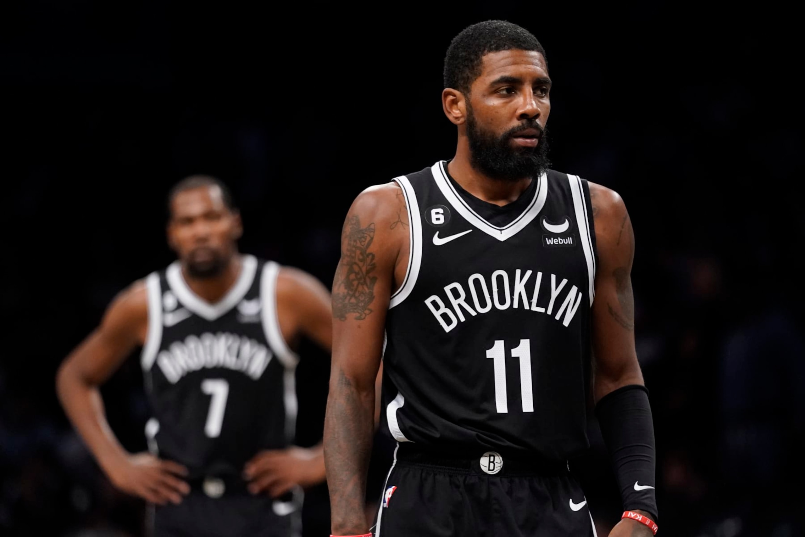 Brooklyn Nets guard Kyrie Irving (11) walks the court during the second half of an NBA basketball game against the Dallas Mavericks, Thursday, Oct. 27, 2022, in New York. (AP Photo/John Minchillo)