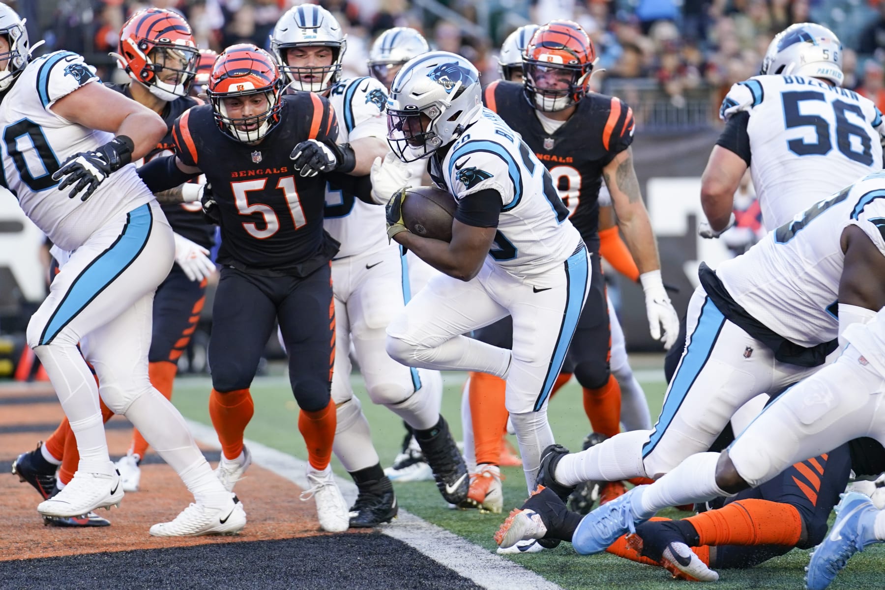 Carolina Panthers running back Raheem Blackshear (20) scores a touchdown as Cincinnati Bengals linebacker Markus Bailey (51) defends during the second half of an NFL football game, Sunday, Nov. 6, 2022, in Cincinnati. The Bengals won 42-21. (AP Photo/Joshua A. Bickel)