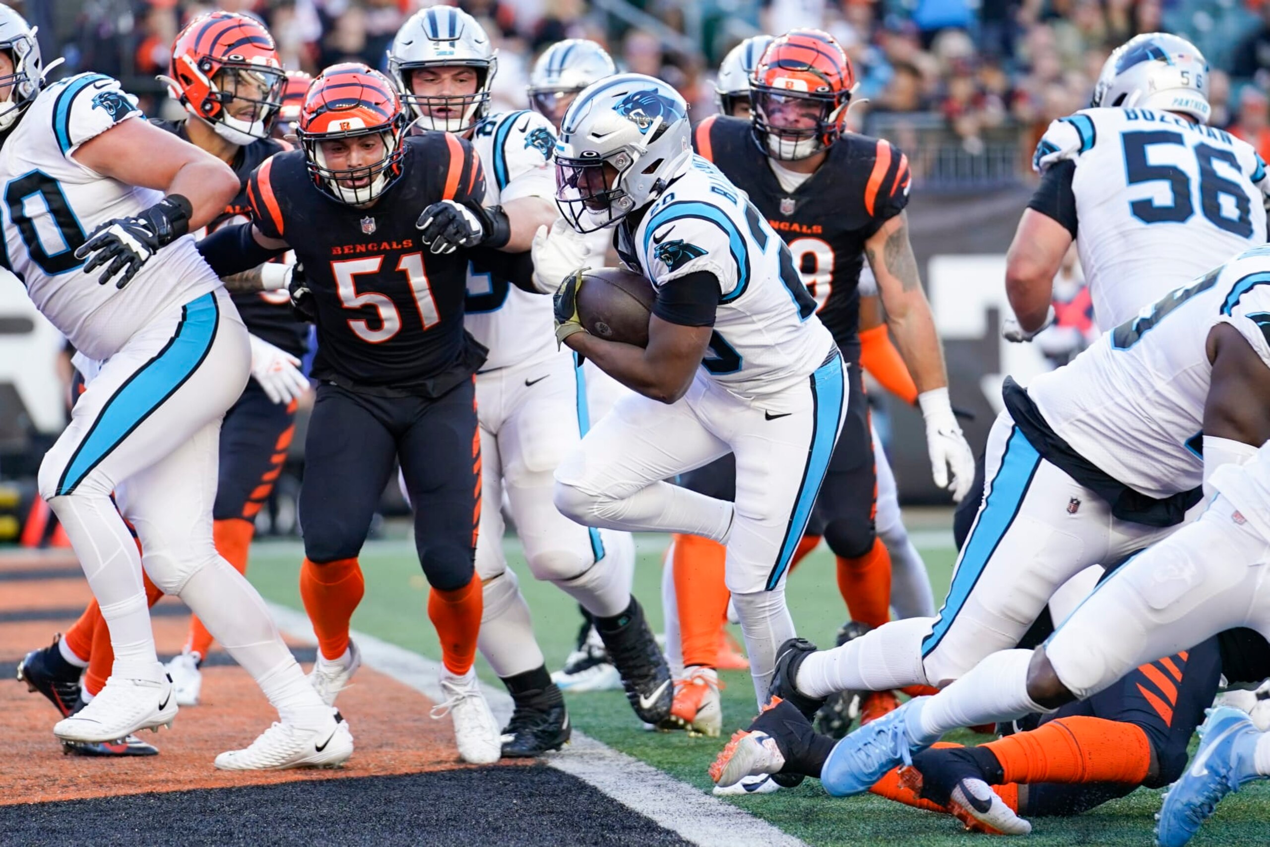 Carolina Panthers running back Raheem Blackshear (20) scores a touchdown as Cincinnati Bengals linebacker Markus Bailey (51) defends during the second half of an NFL football game, Sunday, Nov. 6, 2022, in Cincinnati. The Bengals won 42-21. (AP Photo/Joshua A. Bickel) Carolina Panthers running back Raheem Blackshear (20) scores a touchdown as Cincinnati Bengals linebacker Markus Bailey (51) defends during the second half of an NFL football game, Sunday, Nov. 6, 2022, in Cincinnati. The Bengals won 42-21. (AP Photo/Joshua A. Bickel)