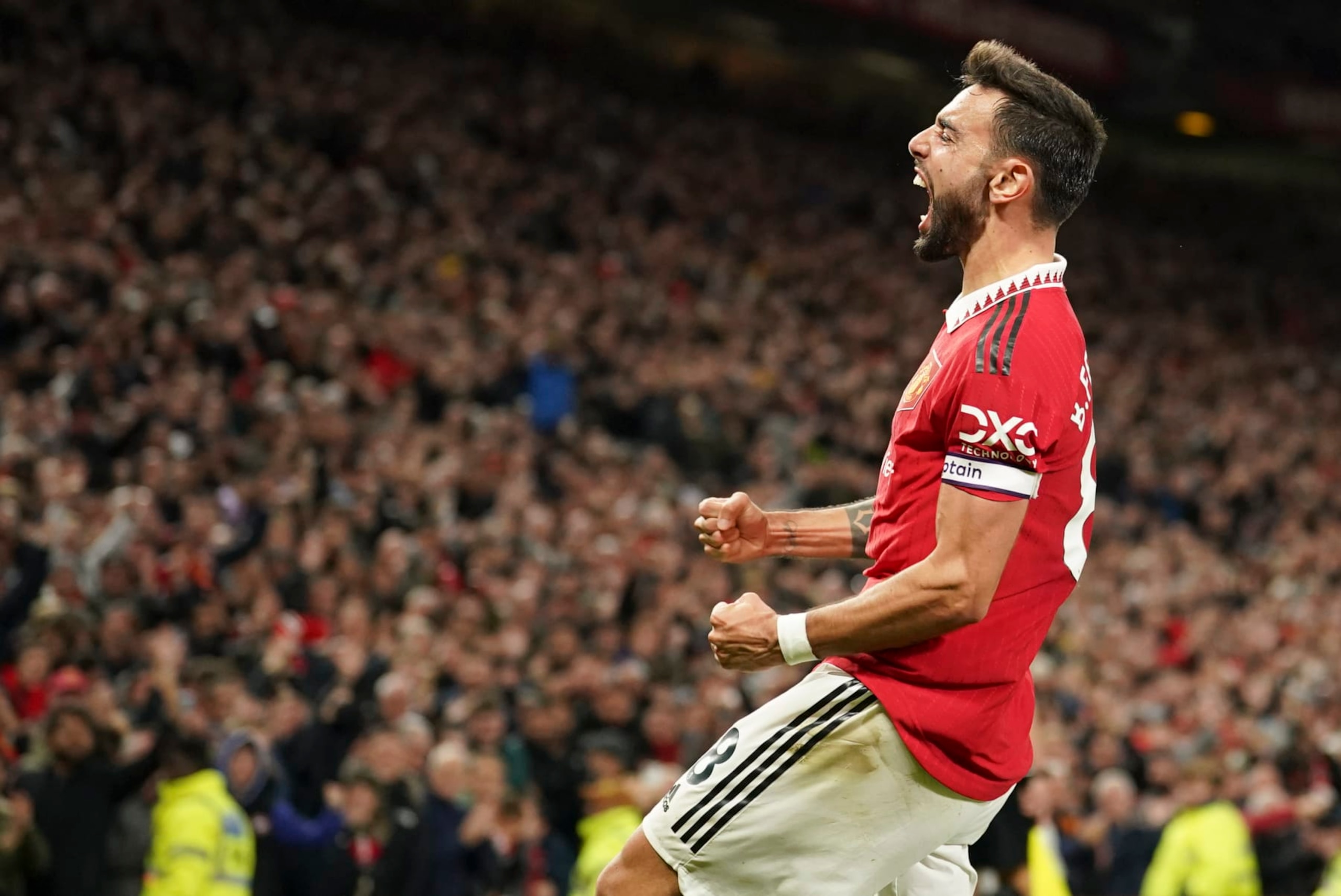 Manchester United's Bruno Fernandes celebrates after scoring his team's second goal during the English Premier League soccer match between Manchester United and Tottenham Hotspur at Old Trafford in Manchester, England, Wednesday, Oct. 19, 2022. (AP Photo/Dave Thompson)