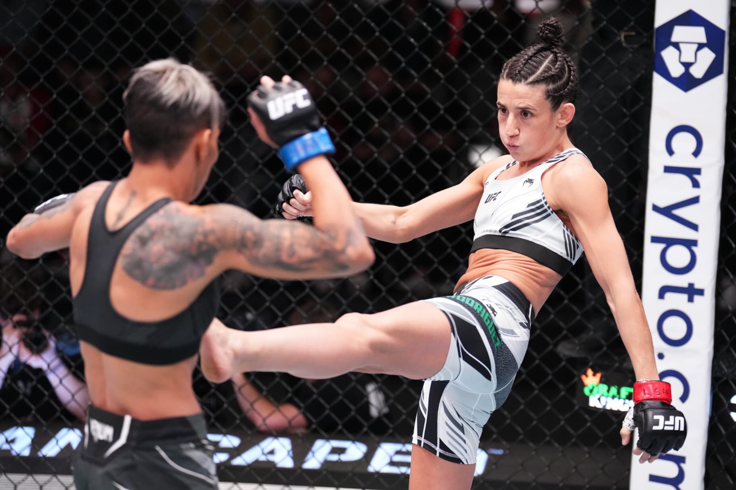 Marina Rodriguez throws a kick at Amanda Lemos. Marina Rodriguez throws a kick at Amanda Lemos.