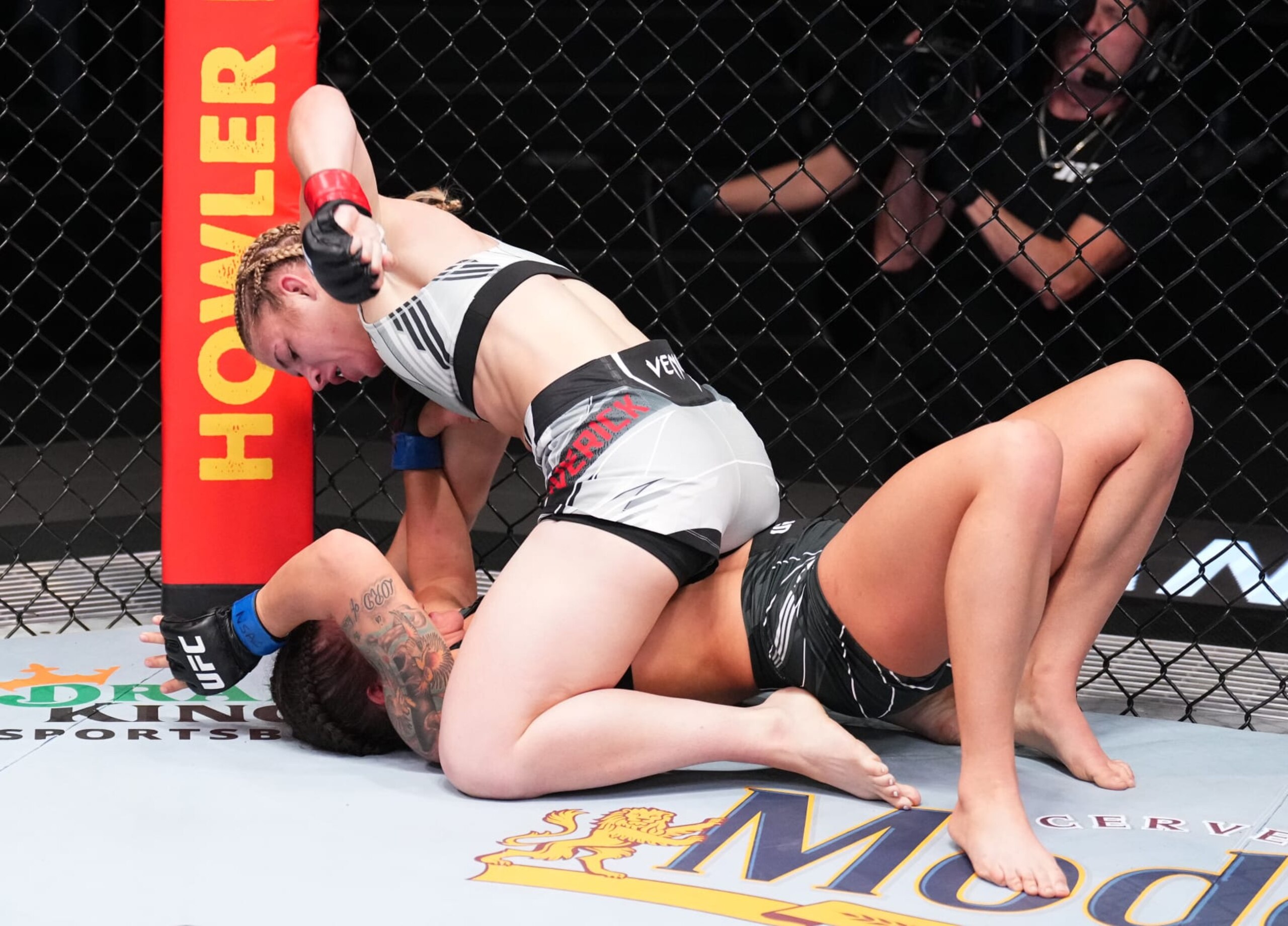 Miranda Maverick strikes Shanna Young from Top Position. Miranda Maverick strikes Shanna Young from Top Position.