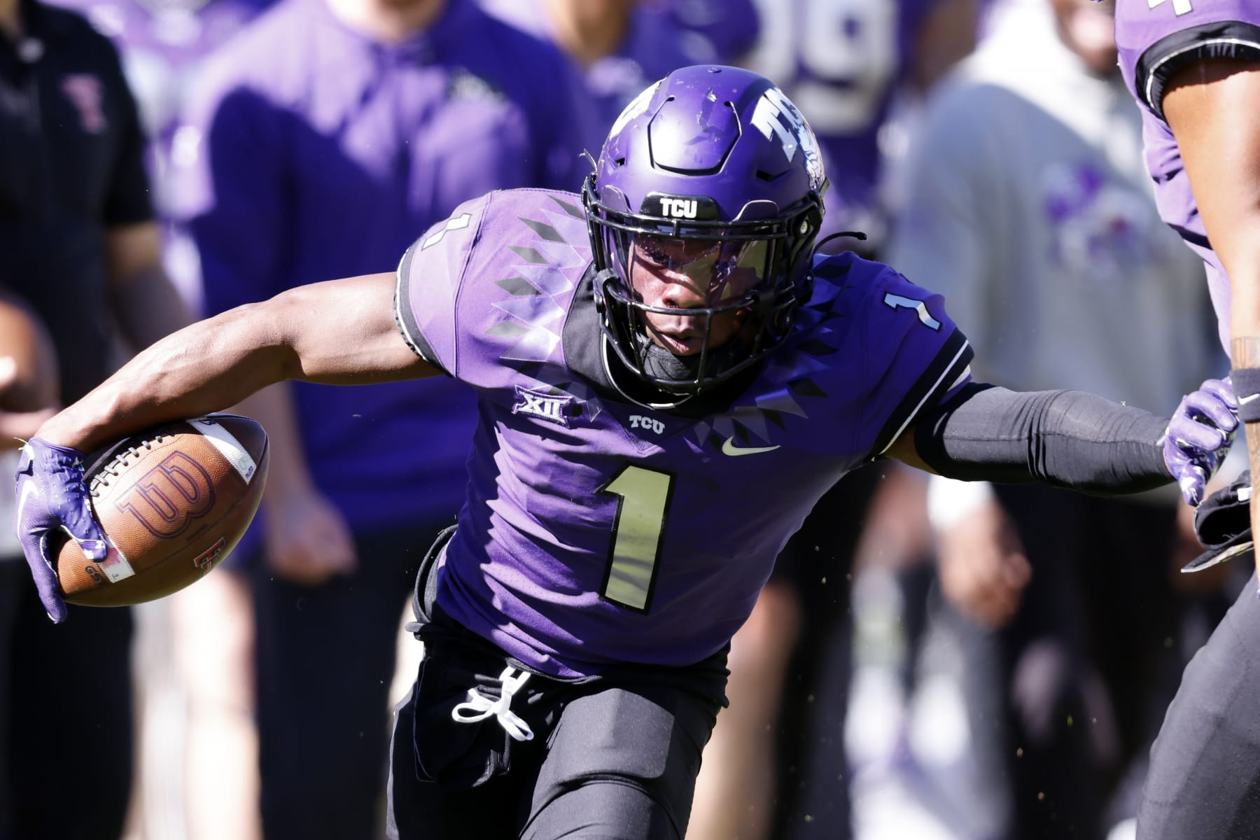 TCU cornerback Tre'Vius Hodges-Tomlinson (1) returns an interception against Texas Tech during the second half of an NCAA college football game Saturday, Nov. 5, 2022, in Fort Worth, Texas. TCU won 34-24.(AP Photo/Ron Jenkins)