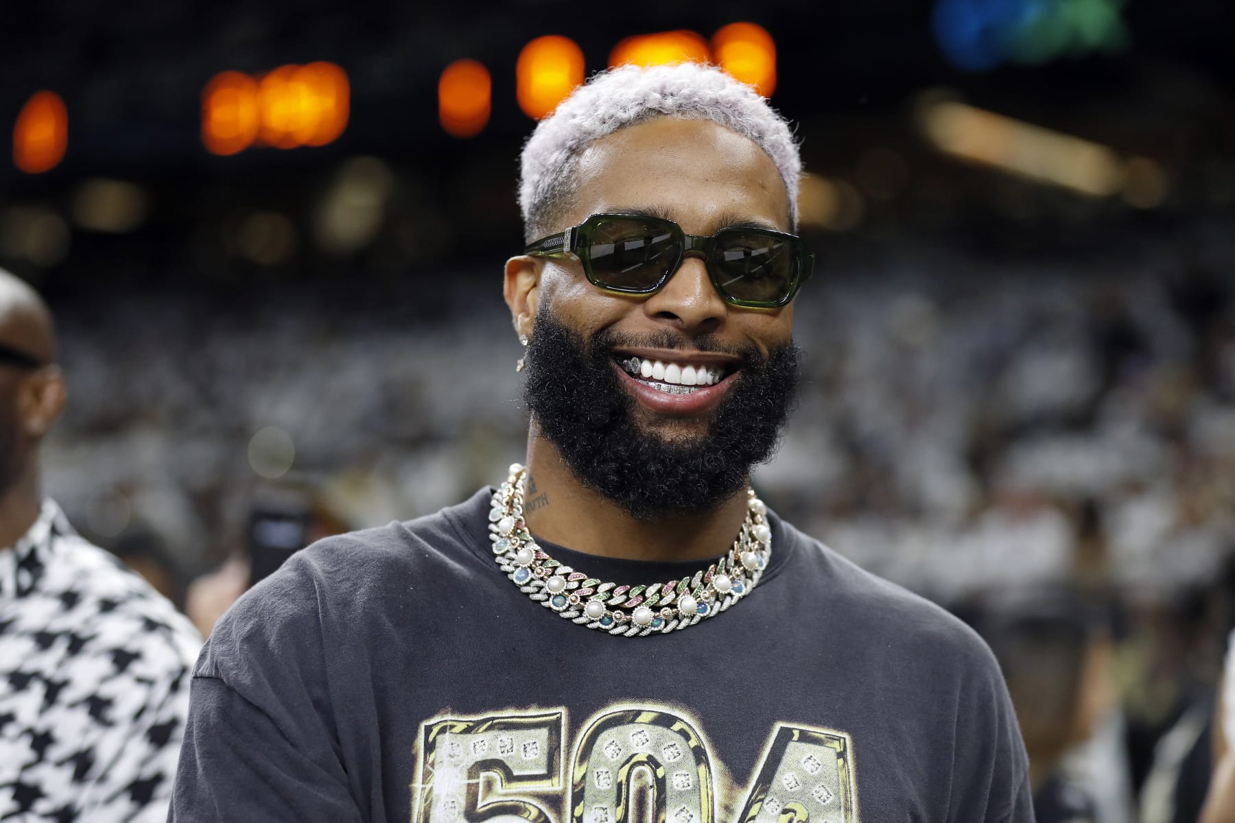 Odell Beckham Jr. poses for a photo on the sidelines before an NFL football game between the New Orleans Saints and the Tampa Bay Buccaneers, Sunday, Sept. 18, 2022, in New Orleans. (AP Photo/Tyler Kaufman)