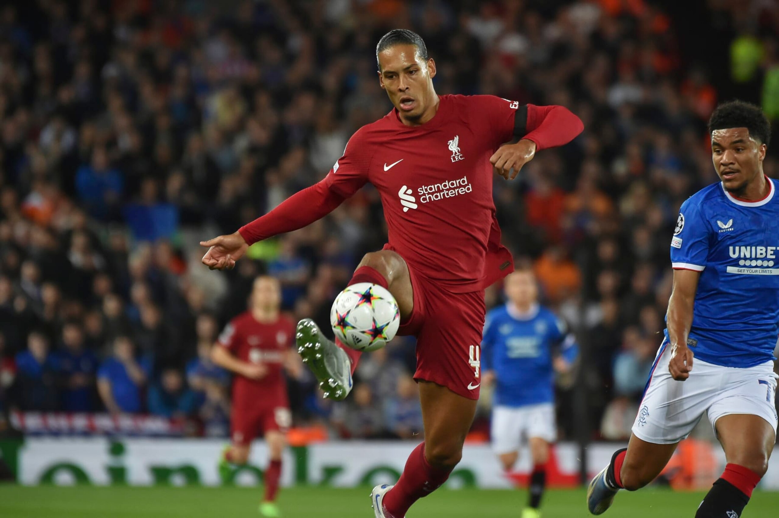 Liverpool's Virgil van Dijk, centre, controls the ball during the Champions League Group A soccer match between Liverpool and Rangers at Anfield stadium in Liverpool, England, Tuesday Oct. 4, 2022. (AP Photo/Rui Vieira)
