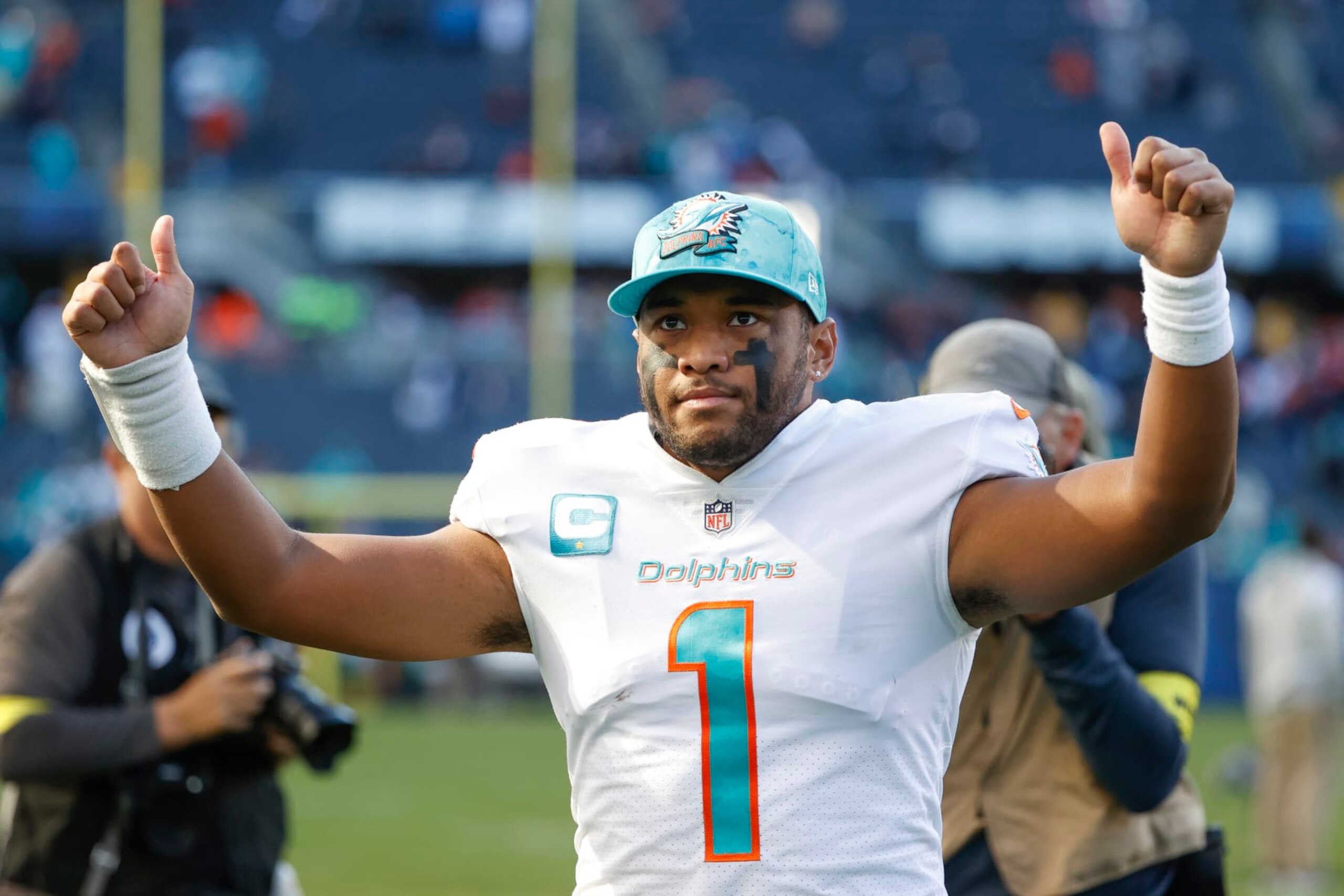 Miami Dolphins quarterback Tua Tagovailoa (1) celebrates as he walks off the field after an NFL football game against the Chicago Bears, Sunday, Nov. 6, 2022, in Chicago. (AP Photo/Kamil Krzaczynski) Miami Dolphins quarterback Tua Tagovailoa (1) celebrates as he walks off the field after an NFL football game against the Chicago Bears, Sunday, Nov. 6, 2022, in Chicago. (AP Photo/Kamil Krzaczynski)