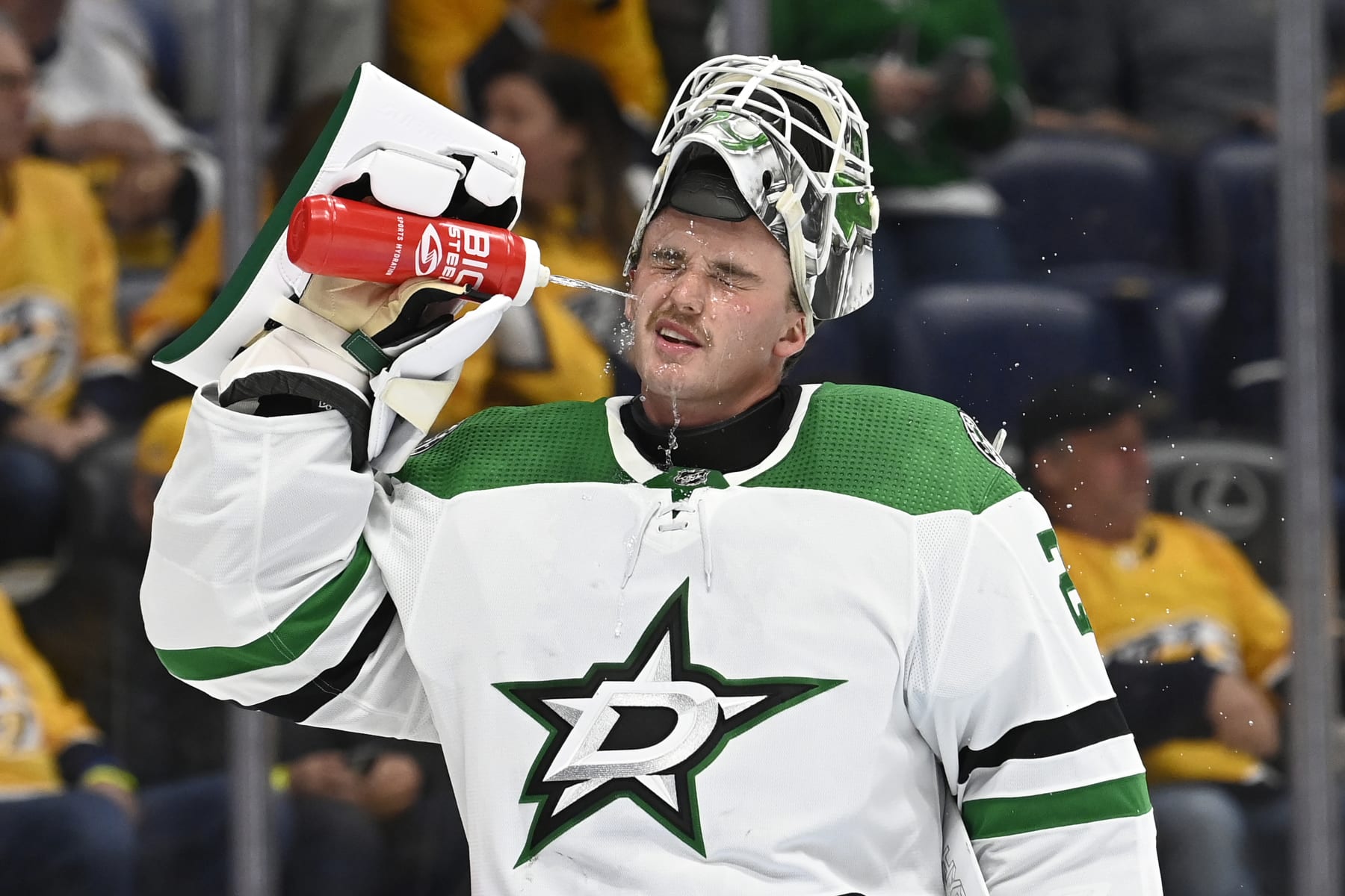 Dallas Stars goaltender Jake Oettinger (29) sprays his face with water during the second period of an NHL hockey game against the Nashville Predators Thursday, Oct. 13, 2022, in Nashville, Tenn. (AP Photo/Mark Zaleski)