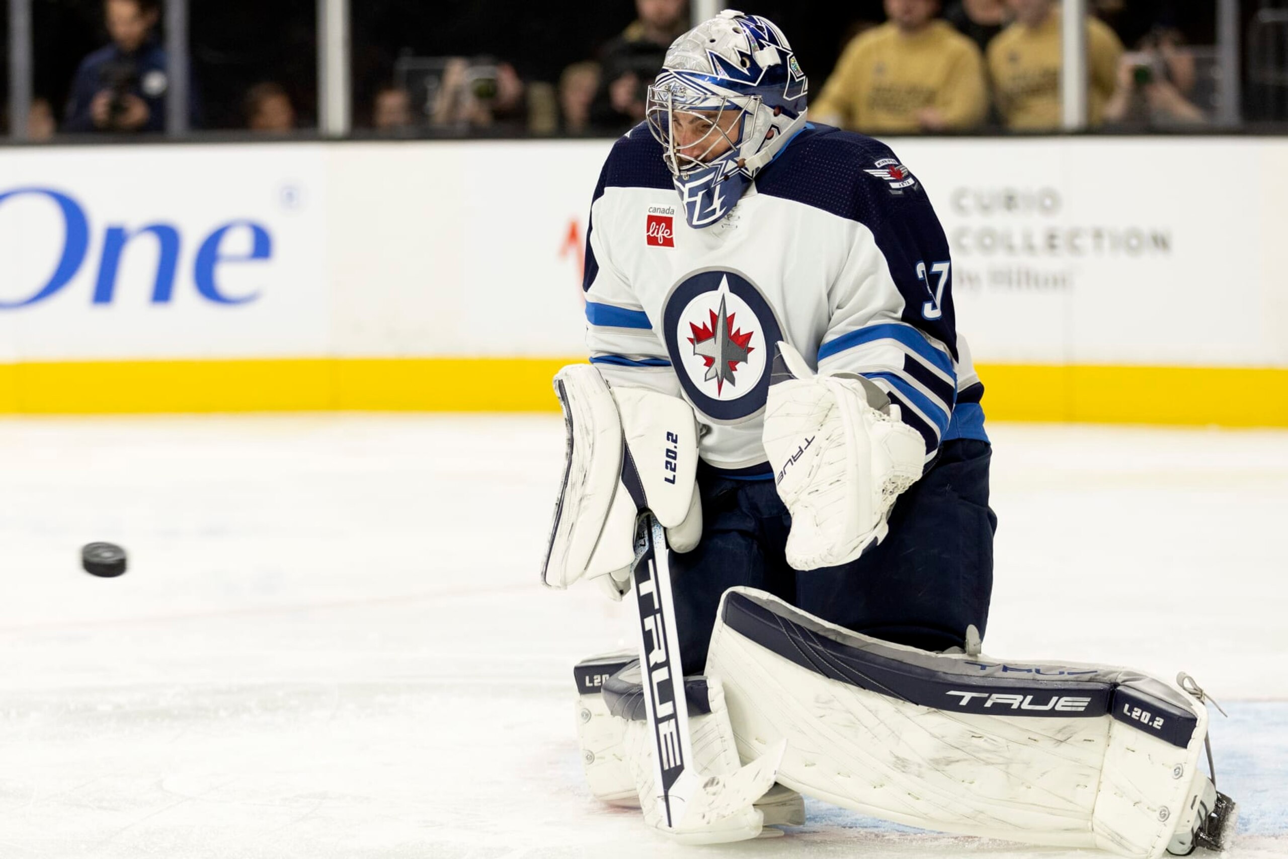 Winnipeg Jets goaltender Connor Hellebuyck (37) prepares to make a save during the second period in an NHL hockey game against the Vegas Golden Knights, Sunday, Oct. 30, 2022, in Las Vegas. (AP Photo/Ellen Schmidt) Winnipeg Jets goaltender Connor Hellebuyck (37) prepares to make a save during the second period in an NHL hockey game against the Vegas Golden Knights, Sunday, Oct. 30, 2022, in Las Vegas. (AP Photo/Ellen Schmidt)