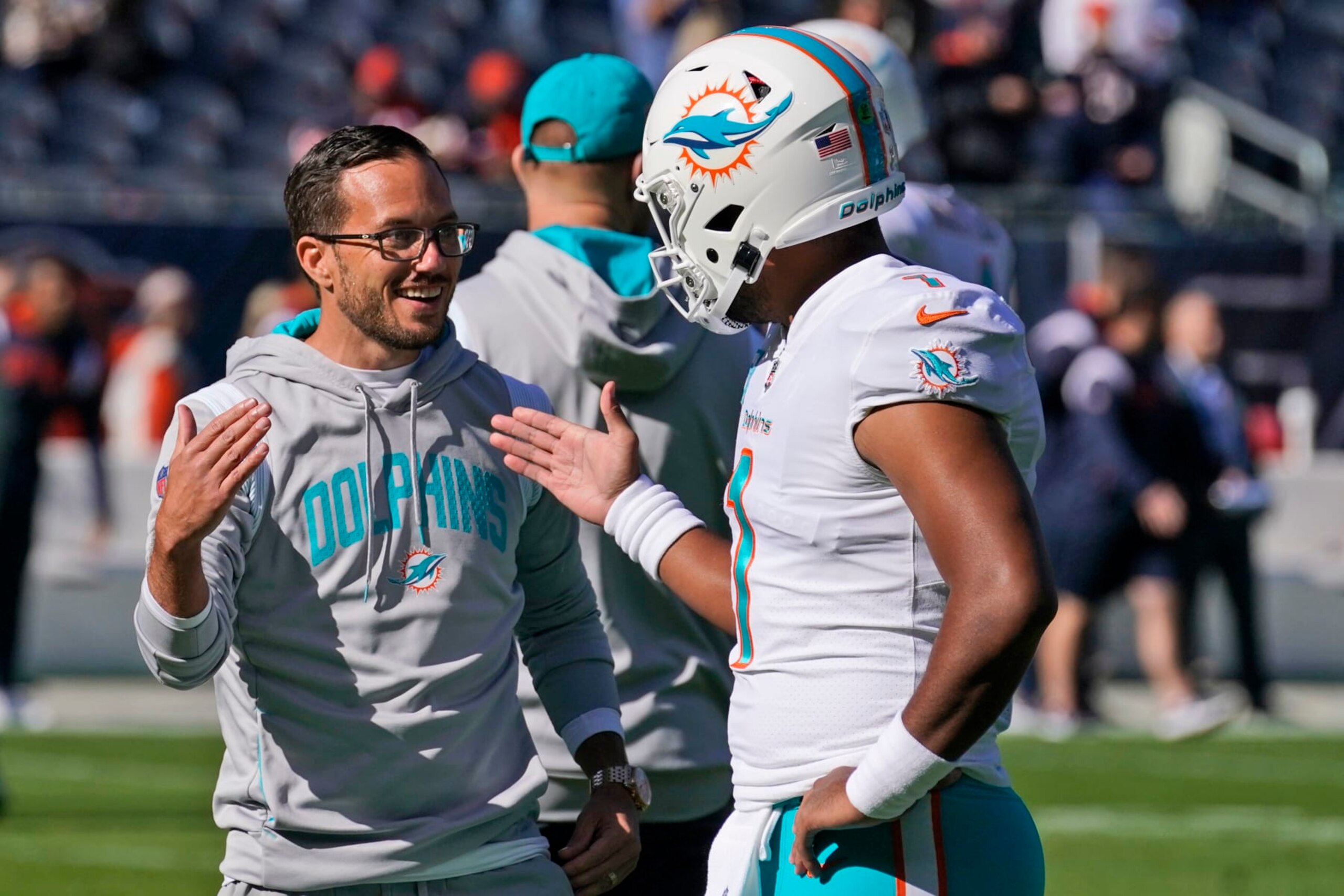 Miami Dolphins head coach Mike McDaniel greets quarterback Tua Tagovailoa as players warm up before the start of an NFL football game against the Chicago Bears, Sunday, Nov. 6, 2022 in Chicago. (AP Photo/Nam Y. Huh) Miami Dolphins head coach Mike McDaniel greets quarterback Tua Tagovailoa as players warm up before the start of an NFL football game against the Chicago Bears, Sunday, Nov. 6, 2022 in Chicago. (AP Photo/Nam Y. Huh)