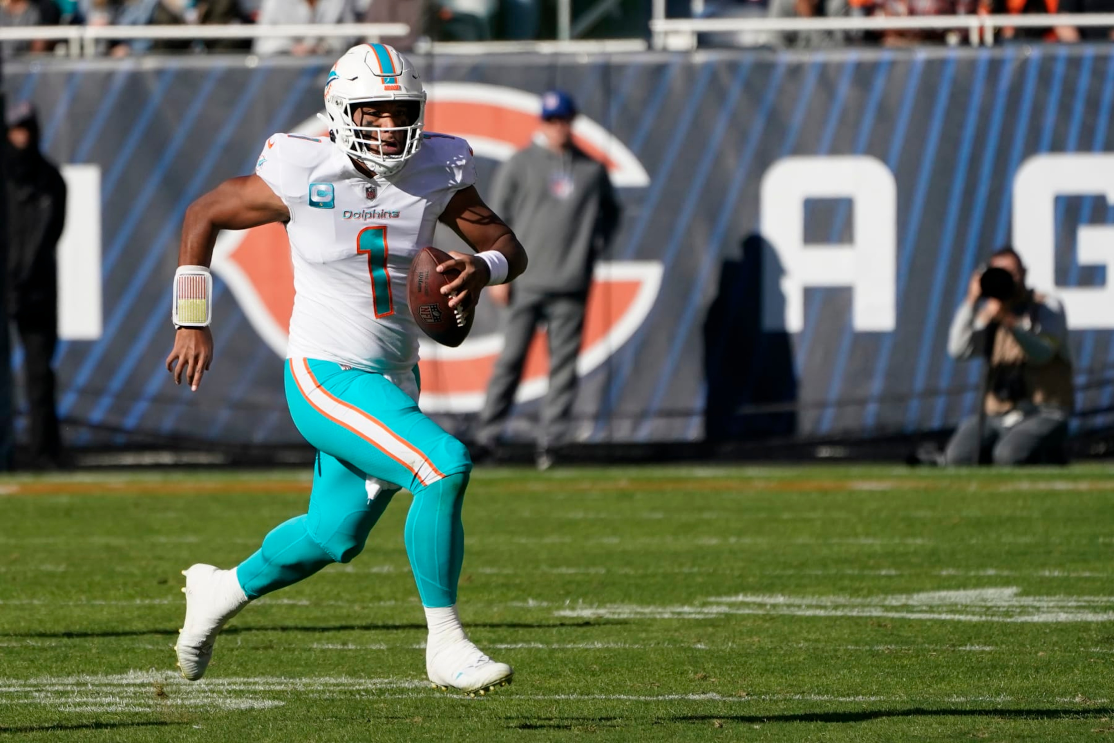Miami Dolphins quarterback Tua Tagovailoa scrambles with the ball during the first half of an NFL football game against the Chicago Bears, Sunday, Nov. 6, 2022 in Chicago. (AP Photo/Charles Rex Arbogast) Miami Dolphins quarterback Tua Tagovailoa scrambles with the ball during the first half of an NFL football game against the Chicago Bears, Sunday, Nov. 6, 2022 in Chicago. (AP Photo/Charles Rex Arbogast)