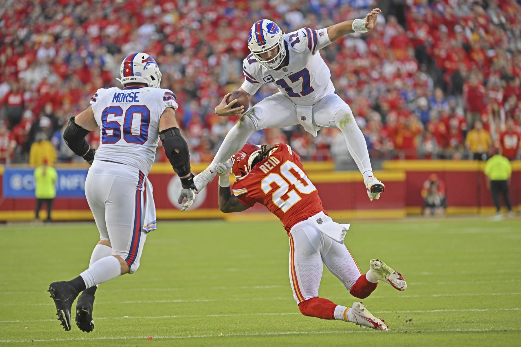 Buffalo Bills quarterback Josh Allen (17) hurdles Kansas City Chiefs safety Justin Reid (20) during an NFL football game Sunday, Oct. 16, 2022, in Kansas City, Mo. (AP Photo/Peter Aiken)