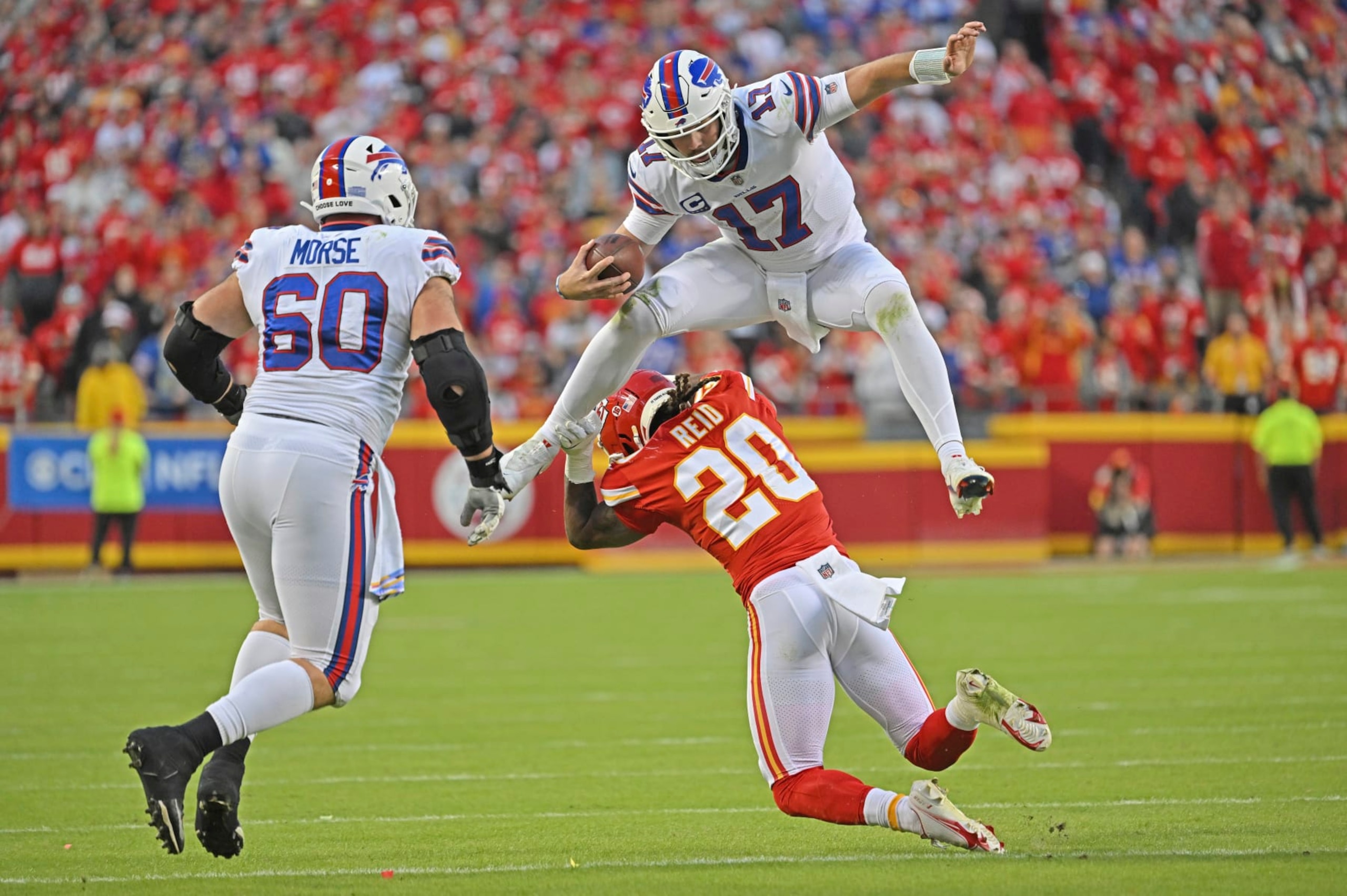 Buffalo Bills quarterback Josh Allen (17) hurdles Kansas City Chiefs safety Justin Reid (20) during an NFL football game Sunday, Oct. 16, 2022, in Kansas City, Mo. (AP Photo/Peter Aiken) Buffalo Bills quarterback Josh Allen (17) hurdles Kansas City Chiefs safety Justin Reid (20) during an NFL football game Sunday, Oct. 16, 2022, in Kansas City, Mo. (AP Photo/Peter Aiken)