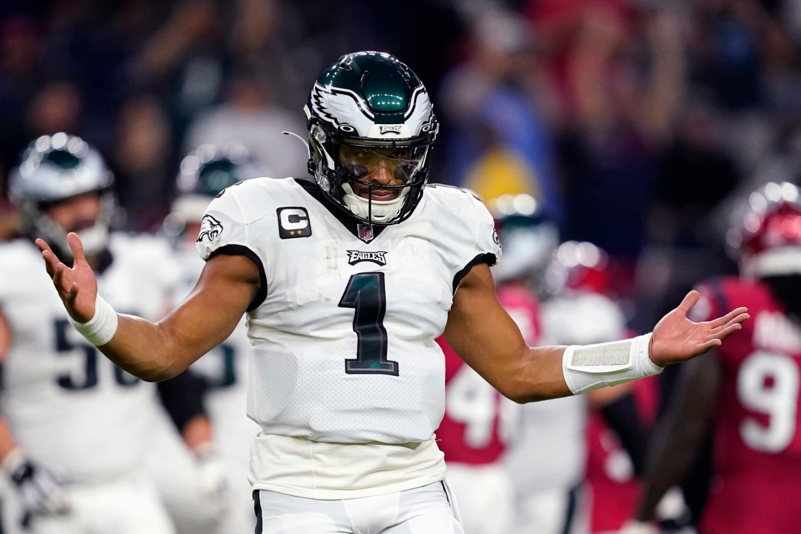 Philadelphia Eagles quarterback Jalen Hurts (1) celebrates after a touchdown by running back Miles Sanders in the first half of an NFL football game against the Houston Texans in Houston, Thursday, Nov. 3, 2022. (AP Photo/Tony Gutierrez) Philadelphia Eagles quarterback Jalen Hurts (1) celebrates after a touchdown by running back Miles Sanders in the first half of an NFL football game against the Houston Texans in Houston, Thursday, Nov. 3, 2022. (AP Photo/Tony Gutierrez)