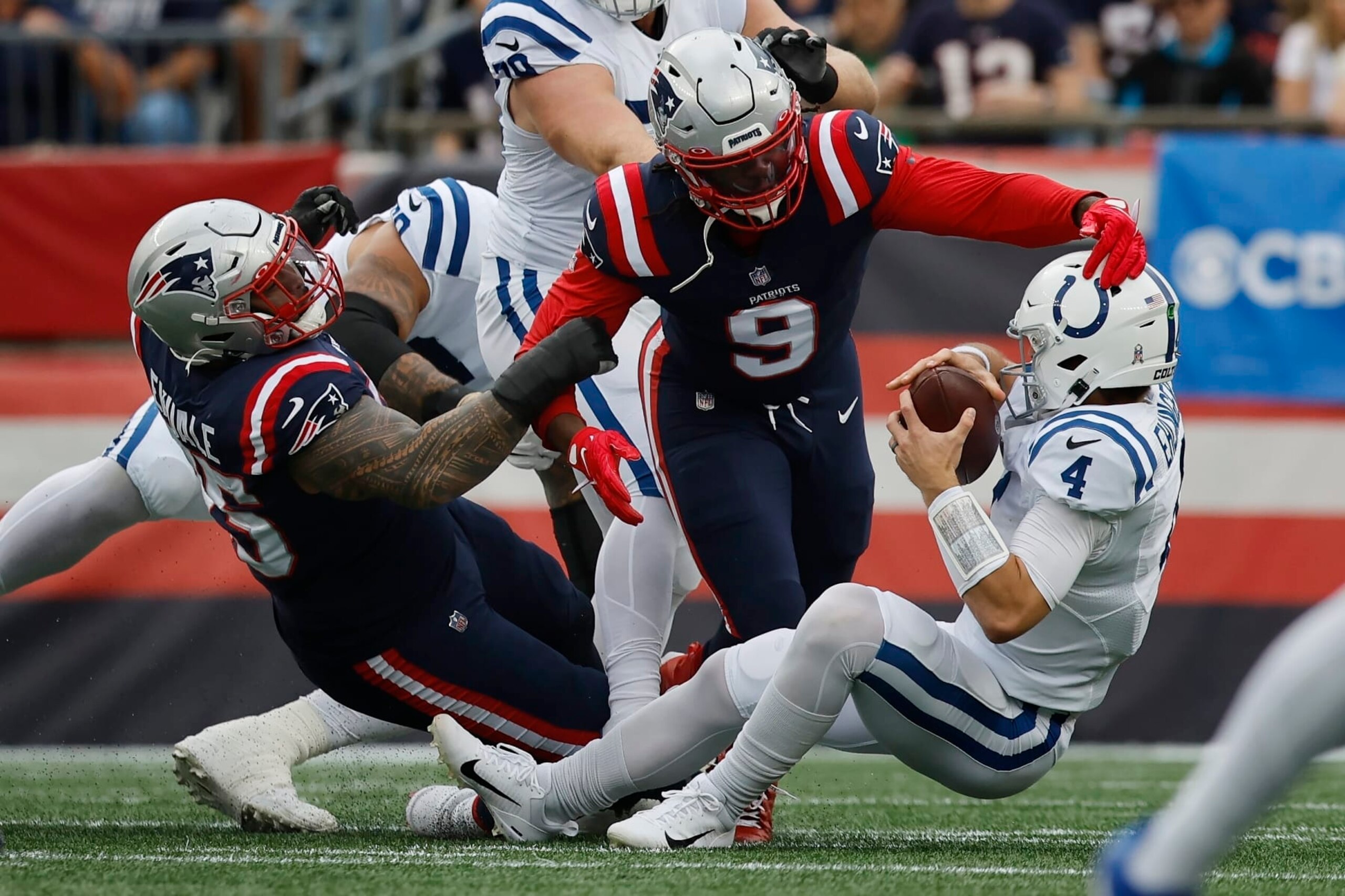 New England Patriots defensive tackle Daniel Ekuale (95) and linebacker Matthew Judon (9) sack Indianapolis Colts quarterback Sam Ehlinger (4) in the first half of an NFL football game, Sunday, Nov. 6, 2022, in Foxborough, Mass. (AP Photo/Michael Dwyer) New England Patriots defensive tackle Daniel Ekuale (95) and linebacker Matthew Judon (9) sack Indianapolis Colts quarterback Sam Ehlinger (4) in the first half of an NFL football game, Sunday, Nov. 6, 2022, in Foxborough, Mass. (AP Photo/Michael Dwyer)