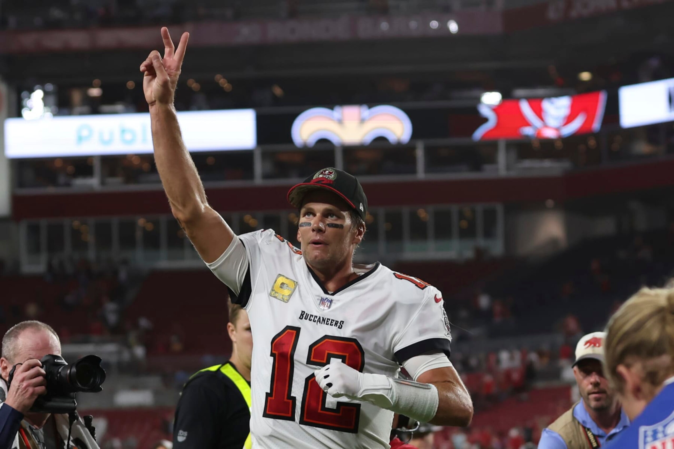 Tampa Bay Buccaneers quarterback Tom Brady (12) waves to spectators after an NFL football game between the Los Angeles Rams and Tampa Bay Buccaneers, Sunday, Nov. 6, 2022, in Tampa, Fla. The Buccaneers defeated the Rams 16-13. Brady become the first player in NFL history with over 100,000 career passing yards. (AP Photo/Mark LoMoglio) Tampa Bay Buccaneers quarterback Tom Brady (12) waves to spectators after an NFL football game between the Los Angeles Rams and Tampa Bay Buccaneers, Sunday, Nov. 6, 2022, in Tampa, Fla. The Buccaneers defeated the Rams 16-13. Brady become the first player in NFL history with over 100,000 career passing yards. (AP Photo/Mark LoMoglio)
